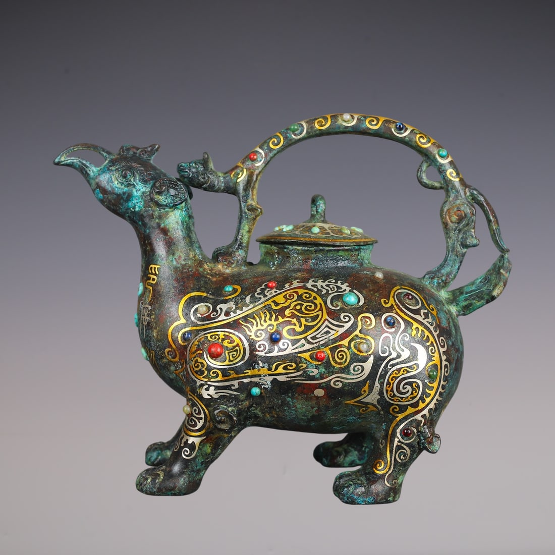An Exquisite Bronze Inlaid Gold Inlaid Gems With Inscription Auspicious Beast-Shaped Ewer: An Exquisite Bronze Inlaid Gold Inlaid Gems With Inscription Auspicious Beast-Shaped Ewer Han Dynasty, China Size:10.2inx8.3in