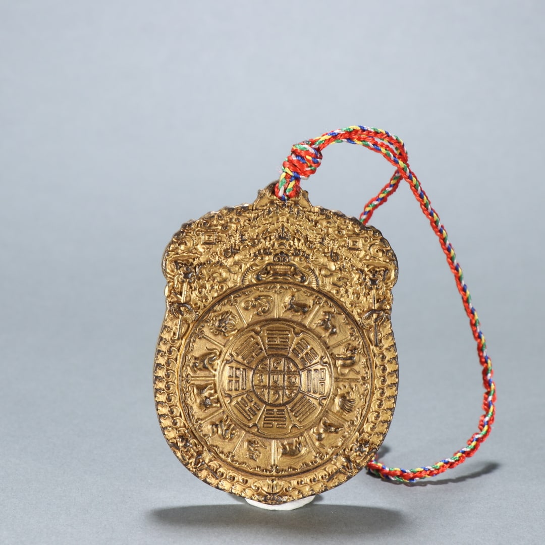 An Exquisite Gilt Bronze Trigram Pattern Brand: An Exquisite Gilt Bronze Trigram Pattern Brand Ming Dynasty, China Yongle Six-character Mark Size:3inx2.2in Weight:131.6g铜鎏金九宫八卦牌