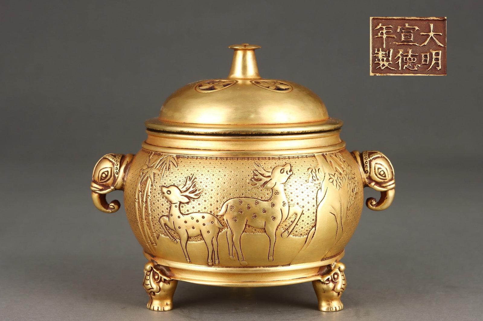 An Exquisite Gilt Bronze Deer Pattern Bamboo Pattern Dragon Pattern Double-Ears and Tripod Censer: An Exquisite Gilt Bronze Deer Pattern Bamboo Pattern Dragon Pattern Double-Ears and Tripod Censer Ming Dynasty, China Xuande Six-character Mark Size:6.9inx6.3in Weight:2900g铜鎏金