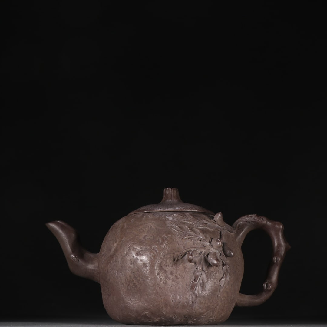 An Exquisite Purple Sands Flower Pattern Teapot: An Exquisite Purple Sands Flower Pattern Teapot Qing Dynasty, China Size:5.1inx8.7in紫砂仿生茶壶 中国清代 Size:13cmx22cm