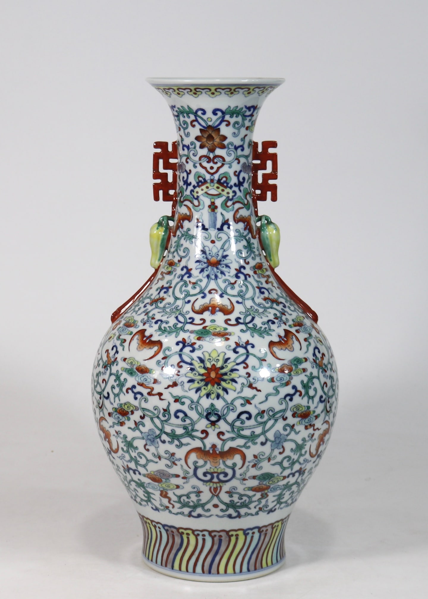 An Exquisite Doucai Lotus Pattern Double-Ears Vase: An Exquisite Doucai Lotus Pattern Double-Ears Vase Qing Dynasty, China Qianlong Six-character Mark Size:17.7inx8.3in斗彩缠枝花卉双耳瓶