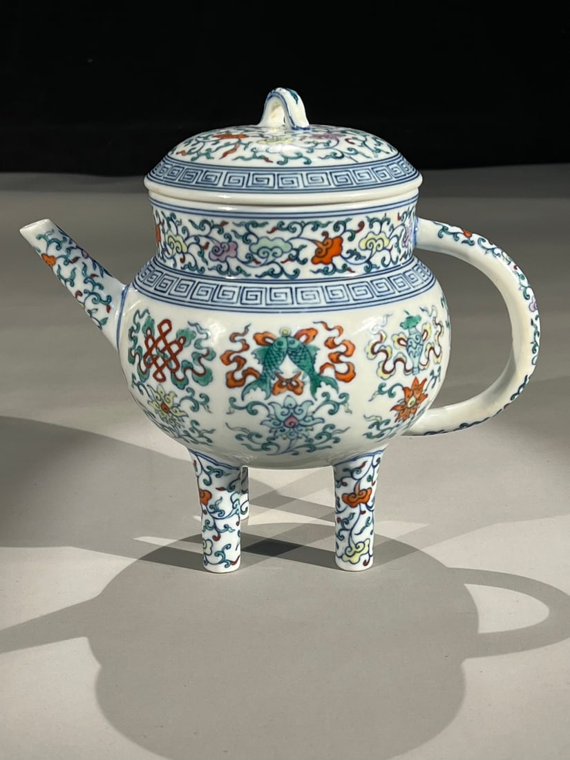 An Exquisite Blue and White Doucai Lotus Pattern Eight Treasures Pattern Ewer: An Exquisite Blue and White Doucai Lotus Pattern Eight Treasures Pattern Ewer Qing Dynasty, China Qianlong Six-character Mark Size:8.7in青花斗彩缠枝八宝