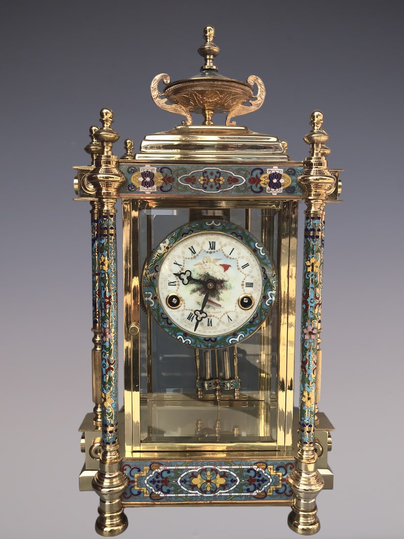 An Exquisite Gilt Bronze Lotus Pattern Clock: An Exquisite Gilt Bronze Lotus Pattern Clock Qing Dynasty, China Size:10.6inx5.9inx18.9in铜鎏金缠枝莲纹钟表 中国清代