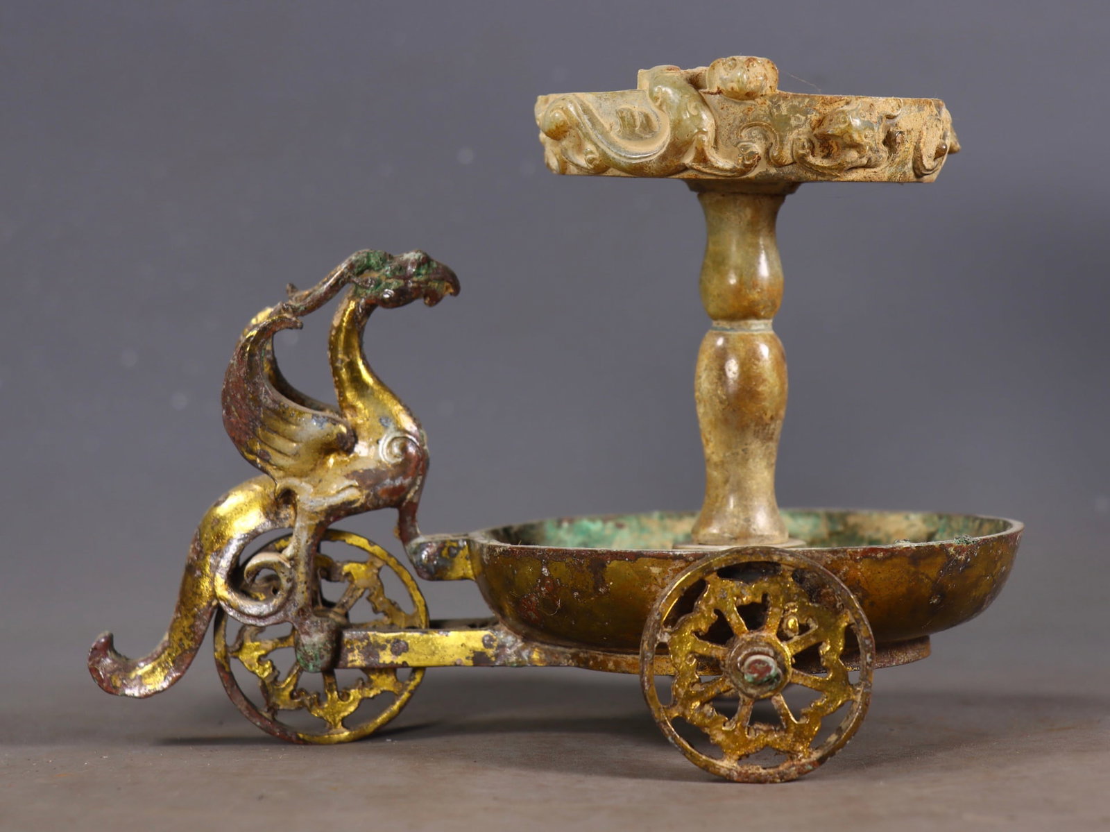 An Exquisite Gilt Bronze Inlaid White Jade Phoenix-Shaped Candlestick: An Exquisite Gilt Bronze Inlaid White Jade Phoenix-Shaped Candlestick Han Dynasty, China Size:5.7inx7.7inx5.1in