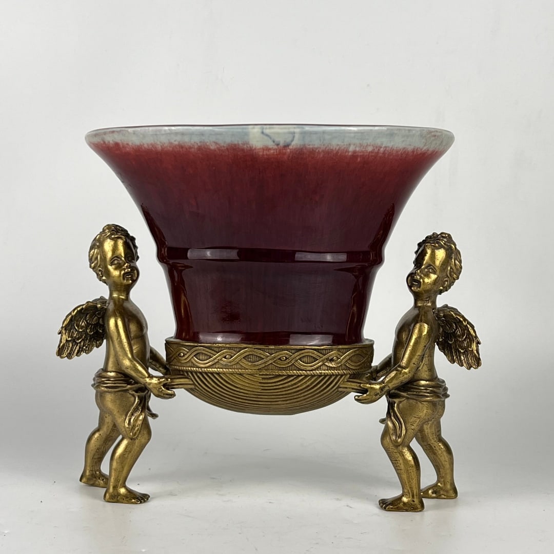 An Exquisite Ji Red Glazed Inlaid Bronze Plate: An Exquisite Ji Red Glazed Inlaid Bronze Plate Qing Dynasty, China Size:9.8inx10.8in霁红釉镶铜天使纹果盘 中国清代