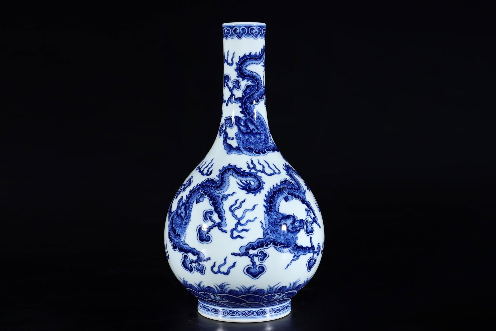 An Exquisite Blue and White Dragon Pattern Seawater Pattern Vase: An Exquisite Blue and White Dragon Pattern Seawater Pattern Vase Qing Dynasty, China Qianlong Six-character Mark Size:13.4inx7.5in青花龙纹胆瓶 中国ę