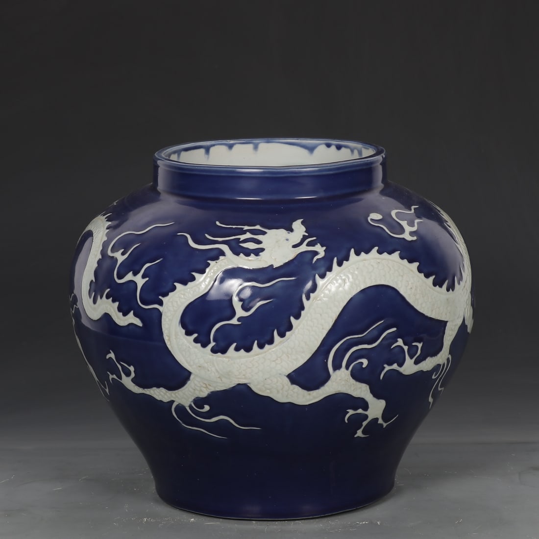 An Exquisite Ji Blue Glazed Dragon Pattern Jar: An Exquisite Ji Blue Glazed Dragon Pattern Jar Yuan Dynasty, China Size:11.4inx12.6in霁蓝留白龙纹大罐 中国元代 Size:29cmx32cm