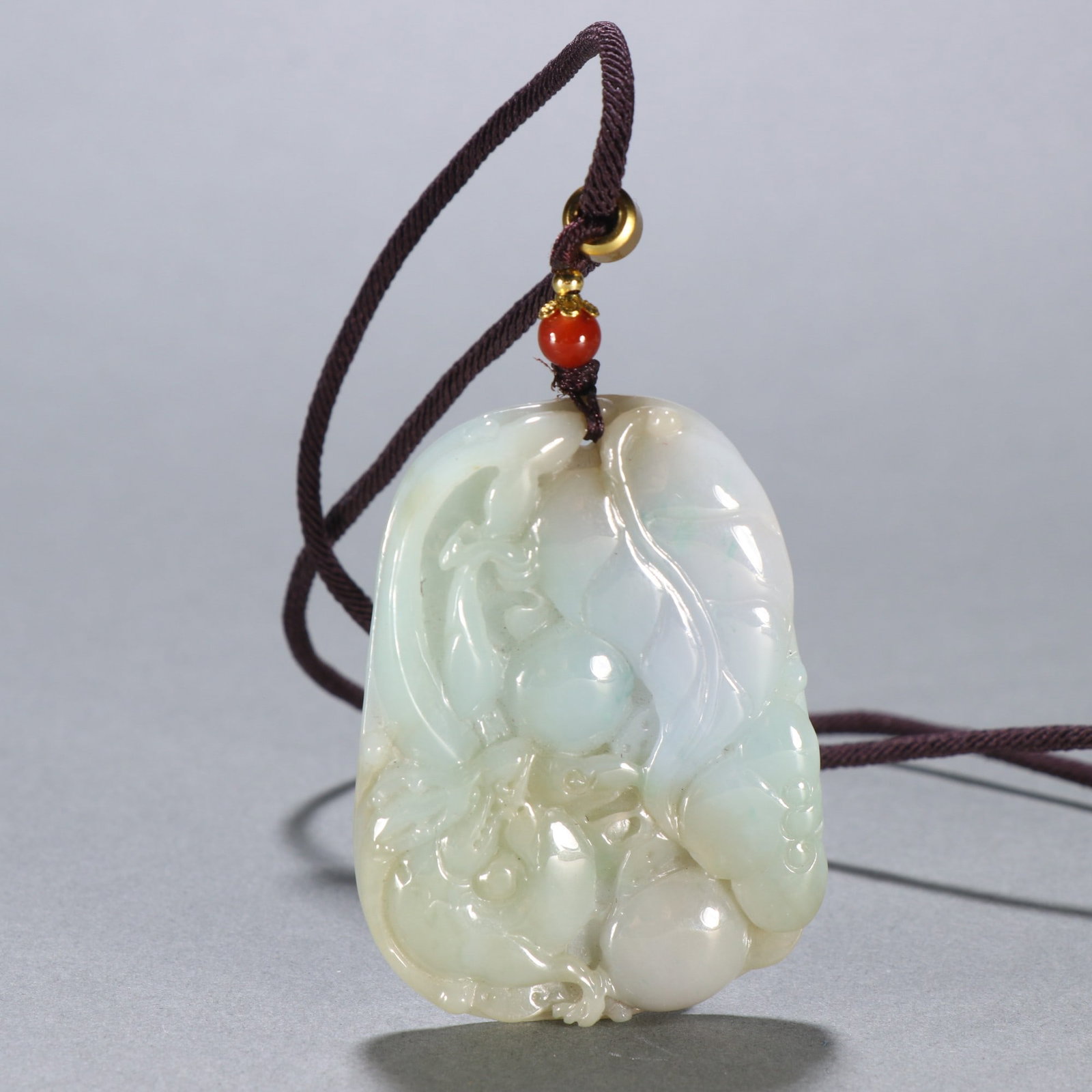 An Exquisite Jadeite Chi-Dragon Pattern Brand: An Exquisite Jadeite Chi-Dragon Pattern Brand Qing Dynasty, China Size:2.4inx1.8in Weight:46.8g翡翠螭龙献寿挂牌 中国清代