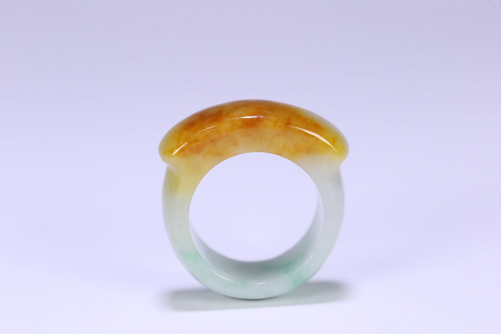 An Exquisite Jadeite Ring: An Exquisite Jadeite Ring Qing Dynasty, China Size:1.3inx1.2inx0.5in Size:(inside diameter)0.8in Weight:15.8g黄翡翠马鞍戒一枚