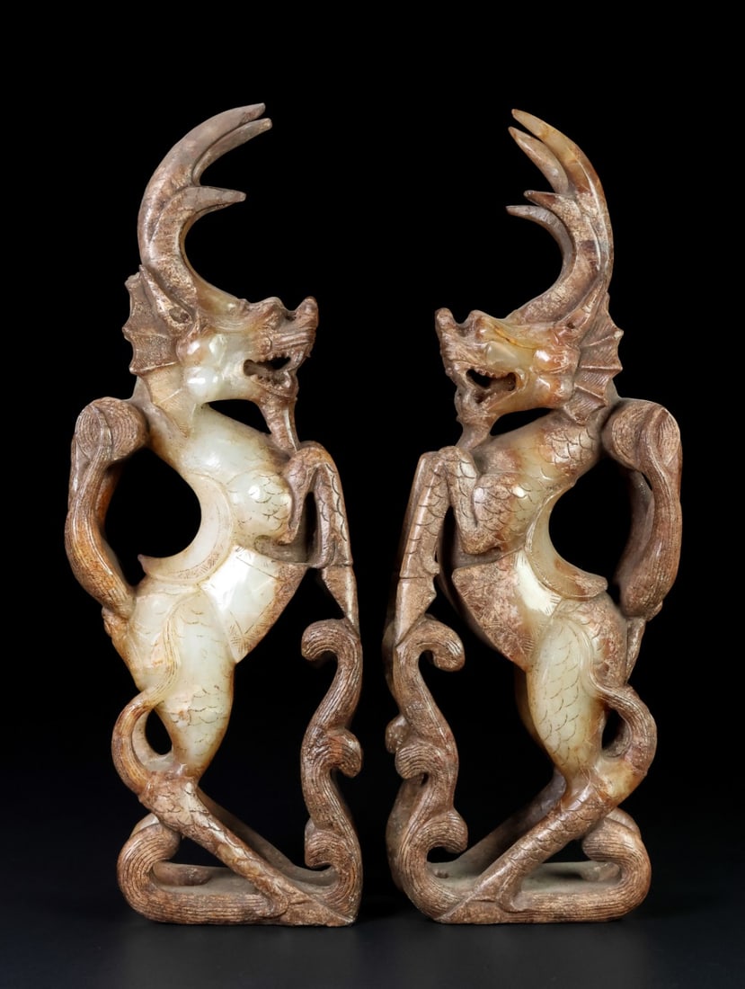 A Pair of Exquisite White Jade Kylin Ornament: A Pair of Exquisite White Jade Kylin Ornament Han Dynasty, China Size:10.2inx3.5inx1.7in Weight:1.674kg白玉麒麟一对 中国汉代 