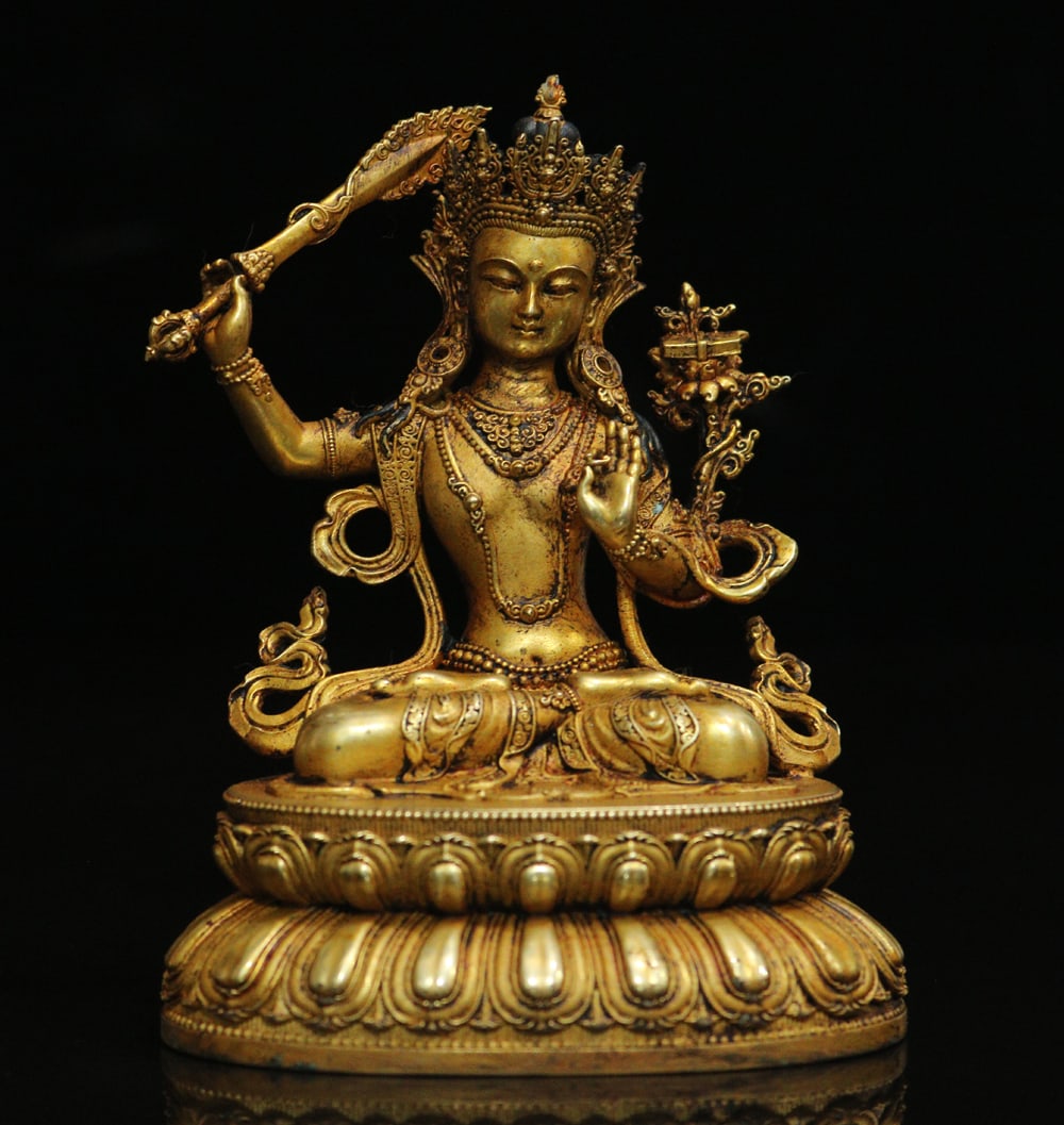 An Exquisite Gilt Bronze Statue of Manjusri Ornament: An Exquisite Gilt Bronze Statue of Manjusri Ornament Ming Dynasty, China Size:3.9inx3.1in Weight:389g铜鎏金文殊菩萨摆件