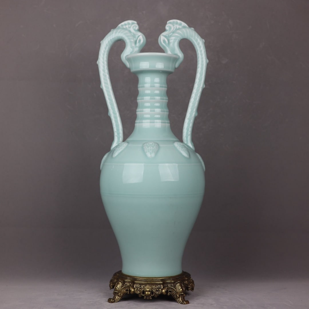 An Exquisite Celadon Glazed Inlaid Bronze Double-Ears Vase: An Exquisite Celadon Glazed Inlaid Bronze Double-Ears Vase Qing Dynasty, China Yongzheng Six-character Mark Size:22.8inx7.9in粉青釉镶铜双龙耳瓶 &#