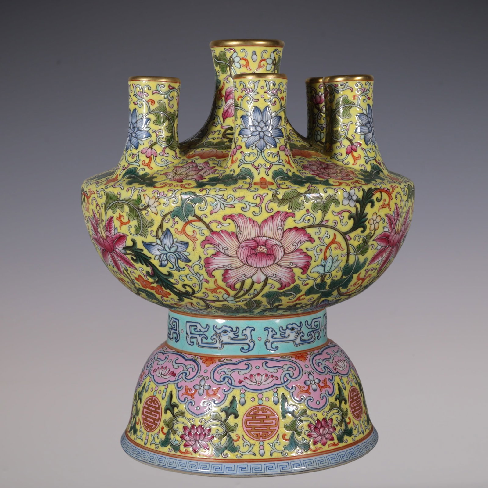 An Exquisite Famille-Rose Lotus Pattern Vase: An Exquisite Famille-Rose Lotus Pattern Vase Qing Dynasty, China Qianlong Four-character Mark Size:10inx9.6in粉彩黄地缠枝莲七管瓶