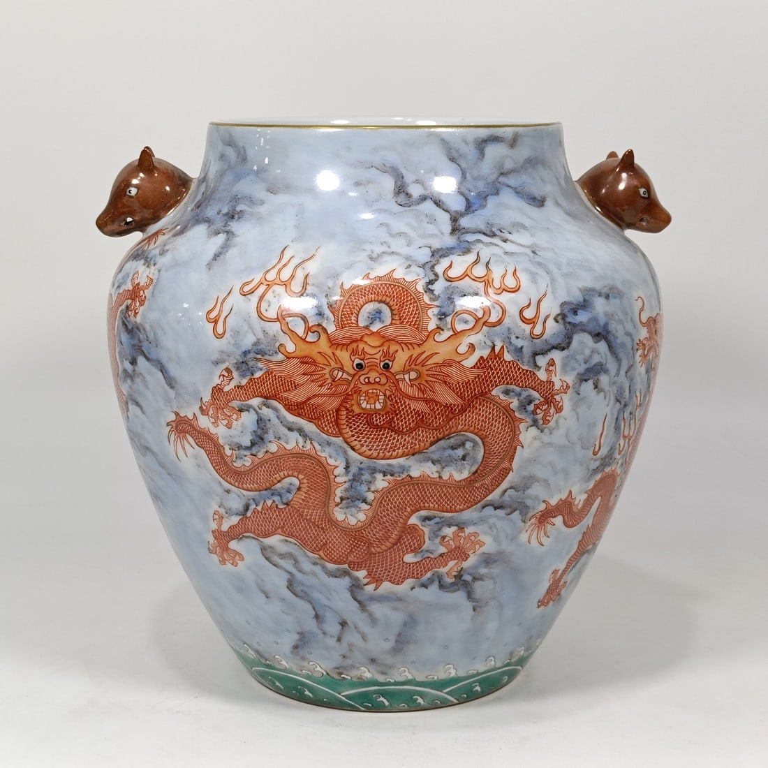 An Exquisite Iron-Red Dragon Pattern Seawater Pattern Double-Ears Jar: An Exquisite Iron-Red Dragon Pattern Seawater Pattern Double-Ears Jar Qing Dynasty, China Yongzheng Six-character Mark Size:9.4inx5.7in矾红五龙图狗头罐