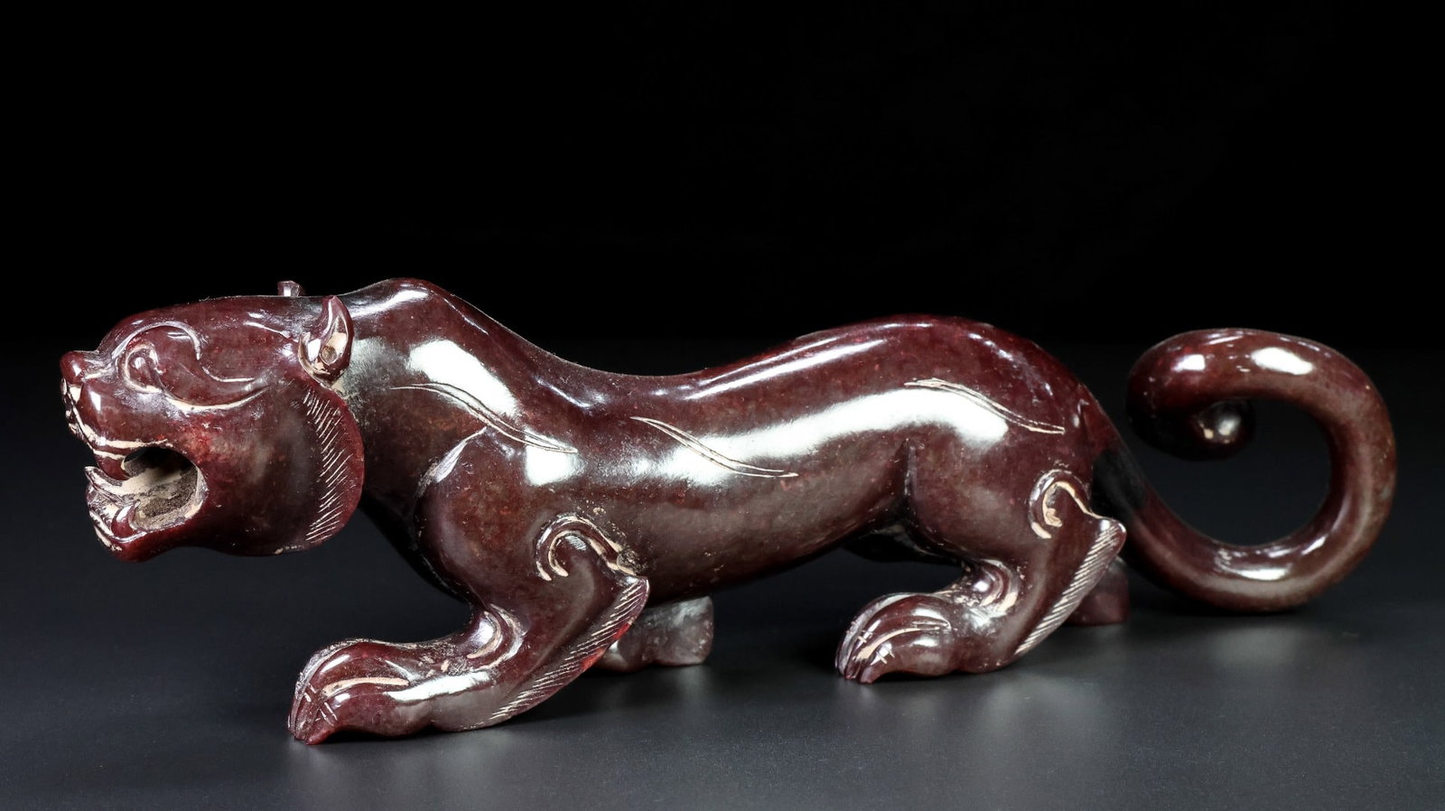 An Exquisite White Jade Tiger Ornament: An Exquisite White Jade Tiger Ornament Han Dynasty, China Size:10.2inx3inx1.8in Weight:898.5g白玉虎摆件 中国汉代 Size:26cmx7.7cmx4.5cm