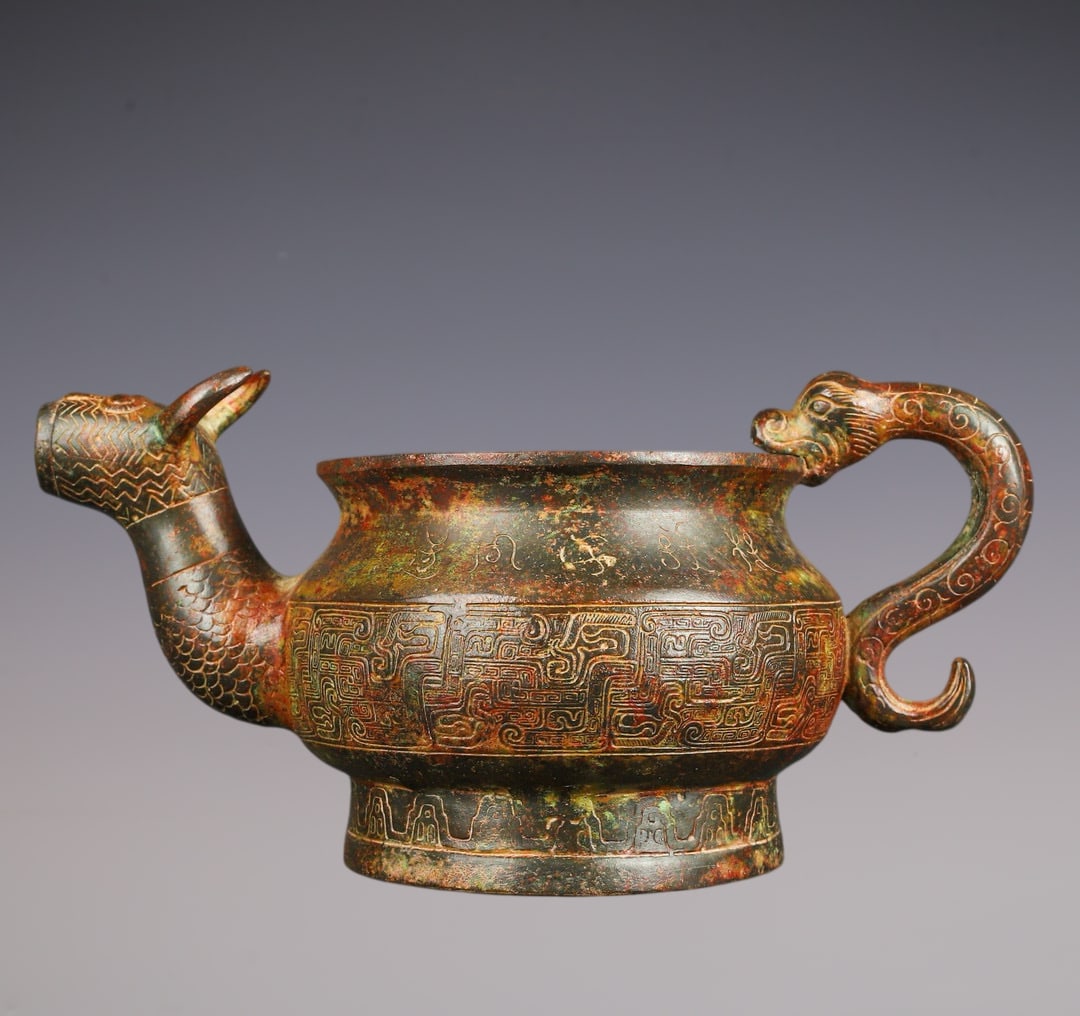 An Exquisite Bronze Auspicious Beast Pattern With Inscription Ewer: An Exquisite Bronze Auspicious Beast Pattern With Inscription Ewer Han Dynasty, China Size:10.2inx5.1in Weight:1400g青铜兽头器皿温酒器