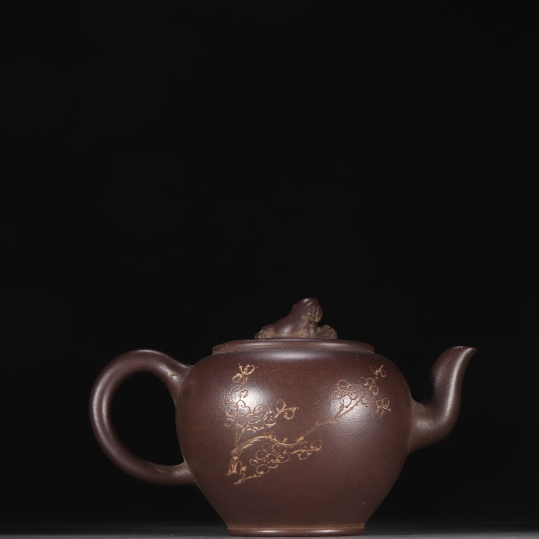 An Exquisite Purple Sands Flower Pattern Teapot: An Exquisite Purple Sands Flower Pattern Teapot Qing Dynasty, China Size:4.3inx6.2in紫砂梅花纹茶壶 中国清代 Size:11cmx15.7cm