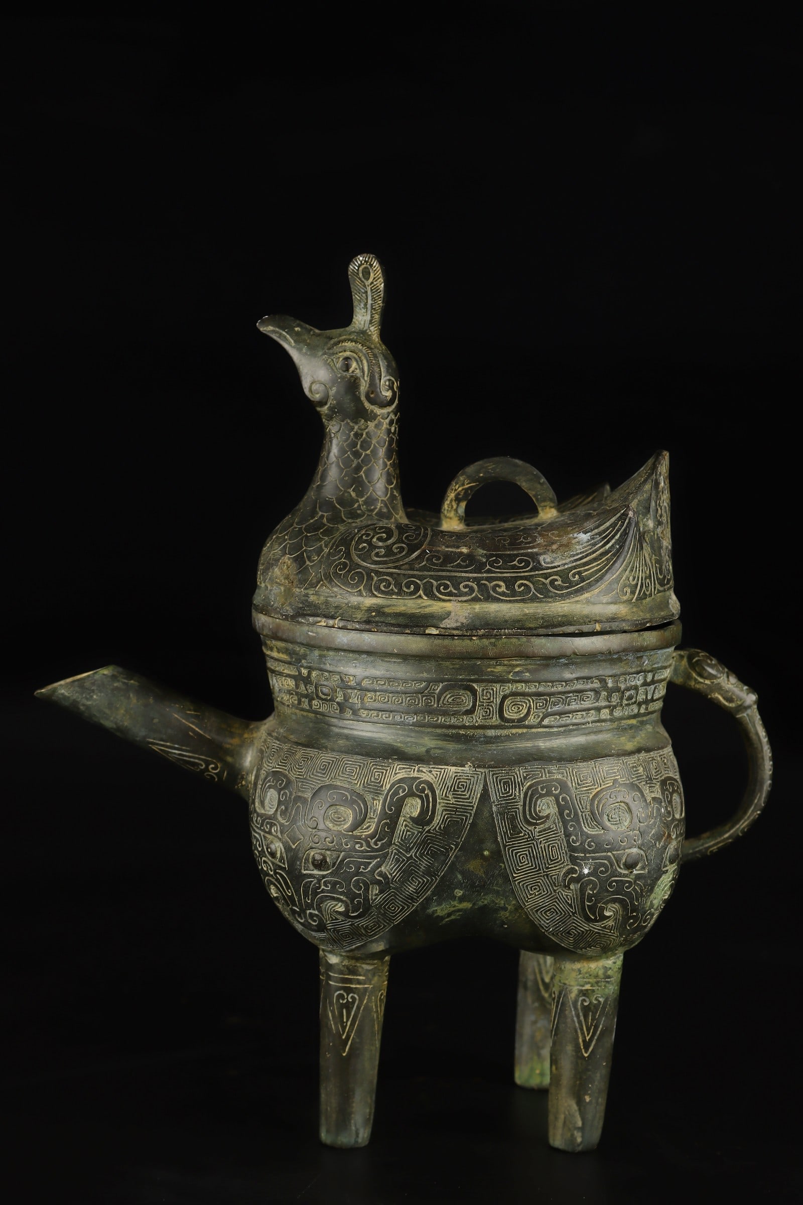 An Exquisite Bronze Beast-Face Pattern Ewer: An Exquisite Bronze Beast-Face Pattern Ewer the Warring States period in China Size:9.8inx7.9in Weight:1395g青铜兽面纹执壶 战国时期