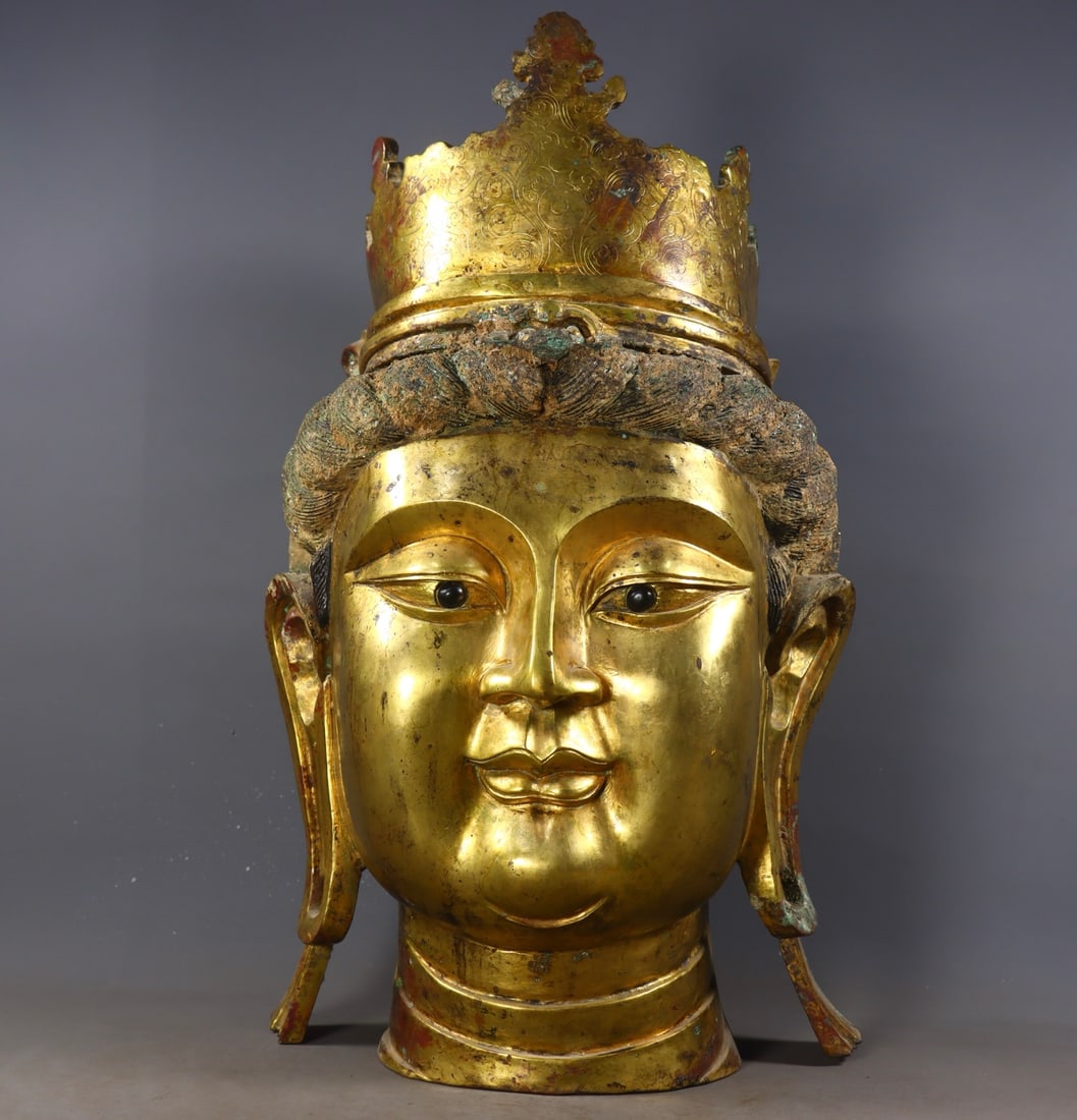 An Exquisite Gilt Bronze Buddha head: An Exquisite Gilt Bronze Buddha head N.Wei , China Size:20.5inx12.4inx10.6in Weight:14910g铜鎏金佛头 北魏时期 Size:52cmx31.5cmx27cm Weight:14910g