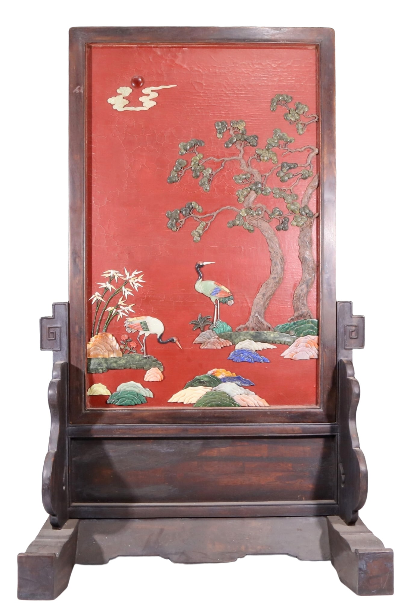 An exquisite zitanwood lacquered table screen with a pine and crane pattern inlaid with gemstones: An exquisite lacquered zitanwood table screen with a pine and crane pattern inlaid with gemstones. Qing Dynasty , China.. It used zitanwood as the base material and was filled with lacquer using
