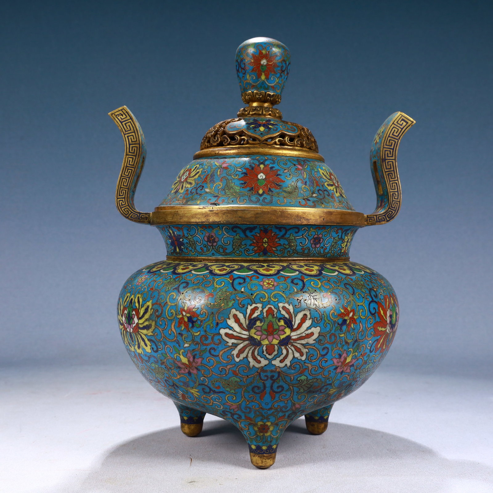 A Rare Cloisonne Lotus Pattern Double-Ears and Tripod Censer: A Rare Cloisonne Lotus Pattern Double-Ears and Tripod Censer,Qing Dynasty, China,Qianlong Four-character Mark,Size:8.7inx11.8in,Weight:2450g 景泰蓝缠枝莲纹