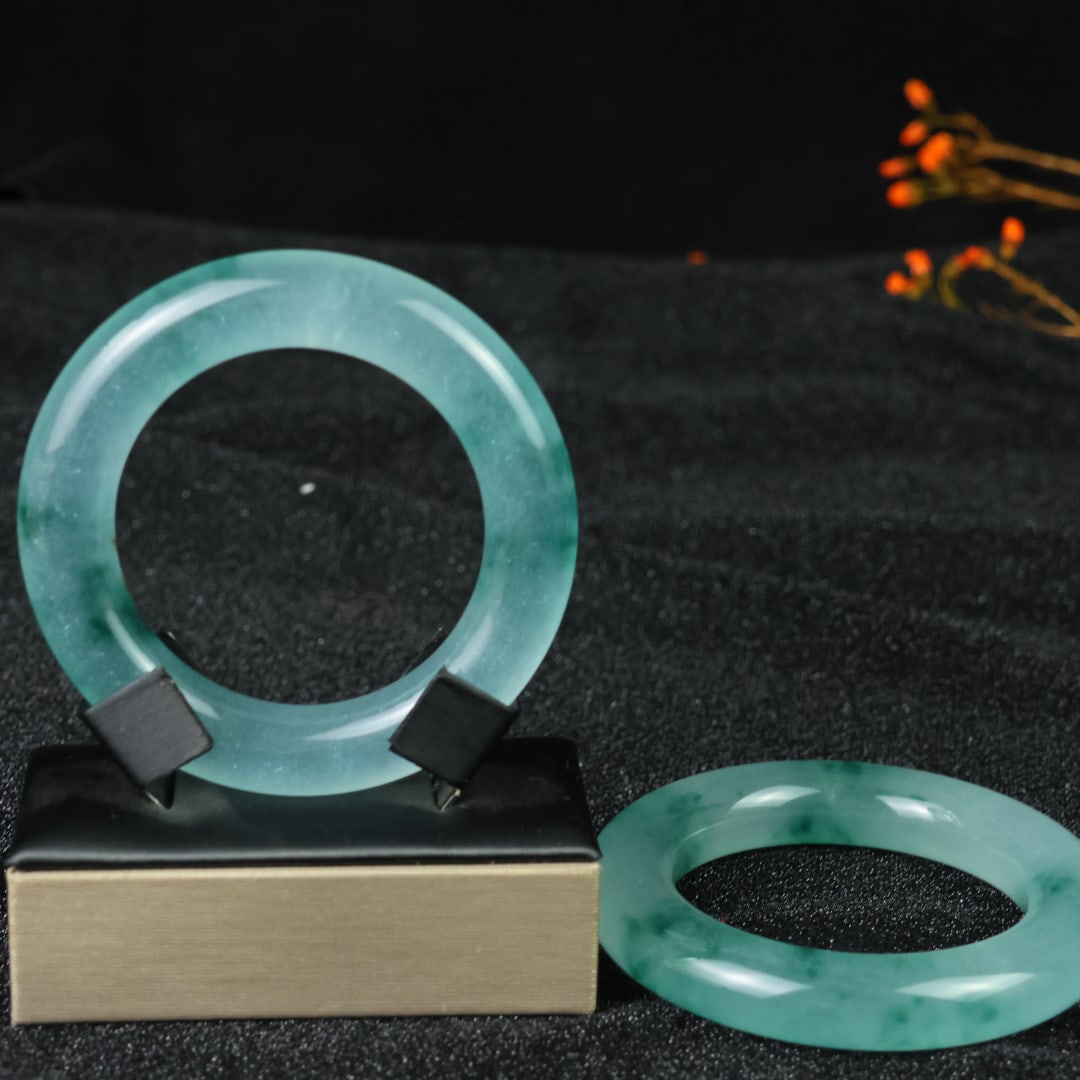 An Exquisite Pair of Jadeite Bracelets: An Exquisite Pair of Jadeite Bracelets，Size:60mmx14mm 翡翠手镯