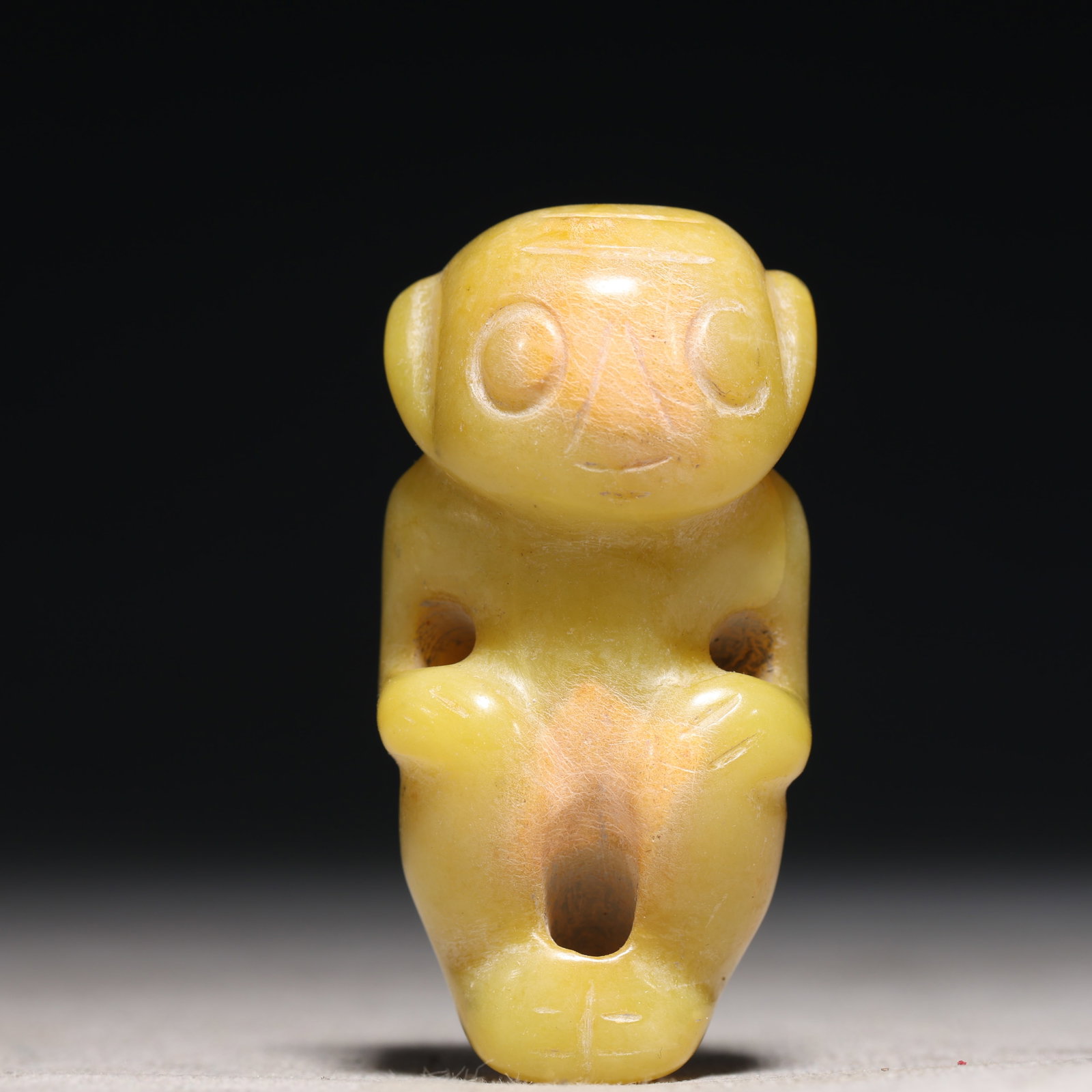 An Archaic Hongshan Culture Yellow Jade Figure Ornament: An Archaic Hongshan Culture Yellow Jade Figure Ornament,Ancient Time, China,Size:1.1inx0.8inx2.4in Weight:54.7g 红山文化黄玉人物摆件,新