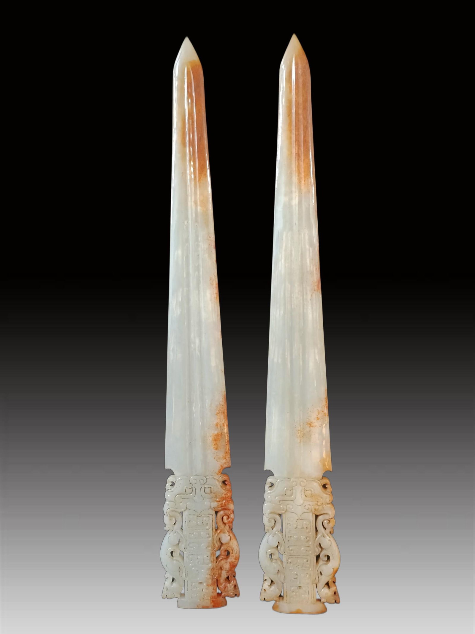 A pair of Exquisite Hotan Jade Weapons: A pair of Exquisite Hotan Jade Weapons,Han Dynasty, China,Size:0.5inx2.8inx19.8in,Weight:526g 一对和田玉武器,中国汉代