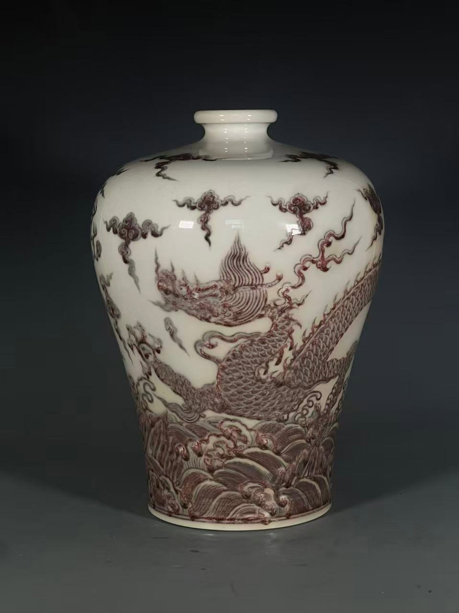 An Exquisite Underglaze-Red Seawater,Auspicious Cloud and Dragon Pattern Vase: An Exquisite Underglaze-Red Seawater,Auspicious Cloud and Dragon Pattern Vase,Qing Dynasty,China,Size:13inx2.6inx6in 釉里红海水祥云龙纹瓶,&#