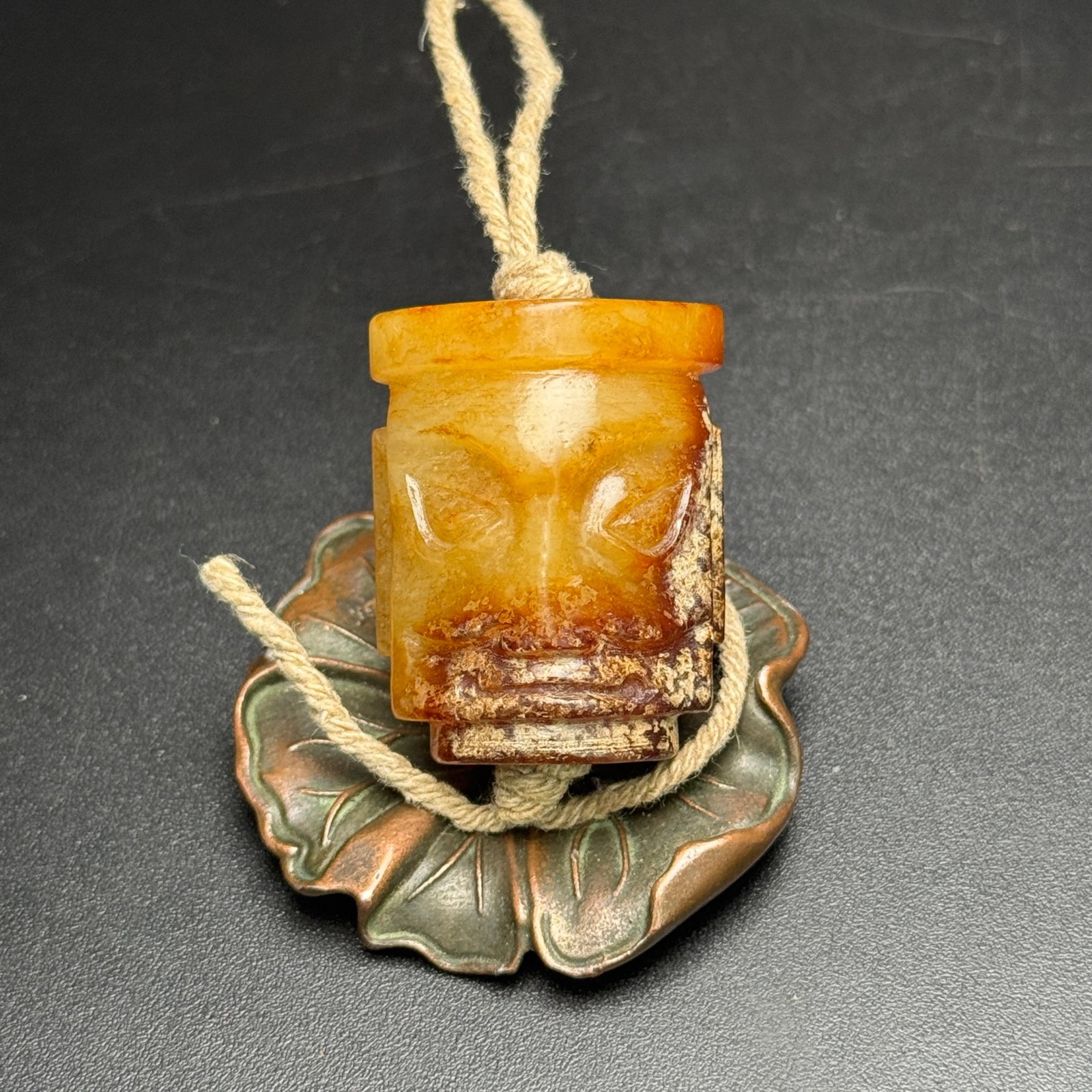 An Exquisite White Jade Figure-Face Pattern Pendant: An Exquisite White Jade Figure-Face Pattern Pendant,Qing Dynasty,China,Size:36mmx29mmx19mm,Weight:39g 白玉人面纹挂件,中国清代