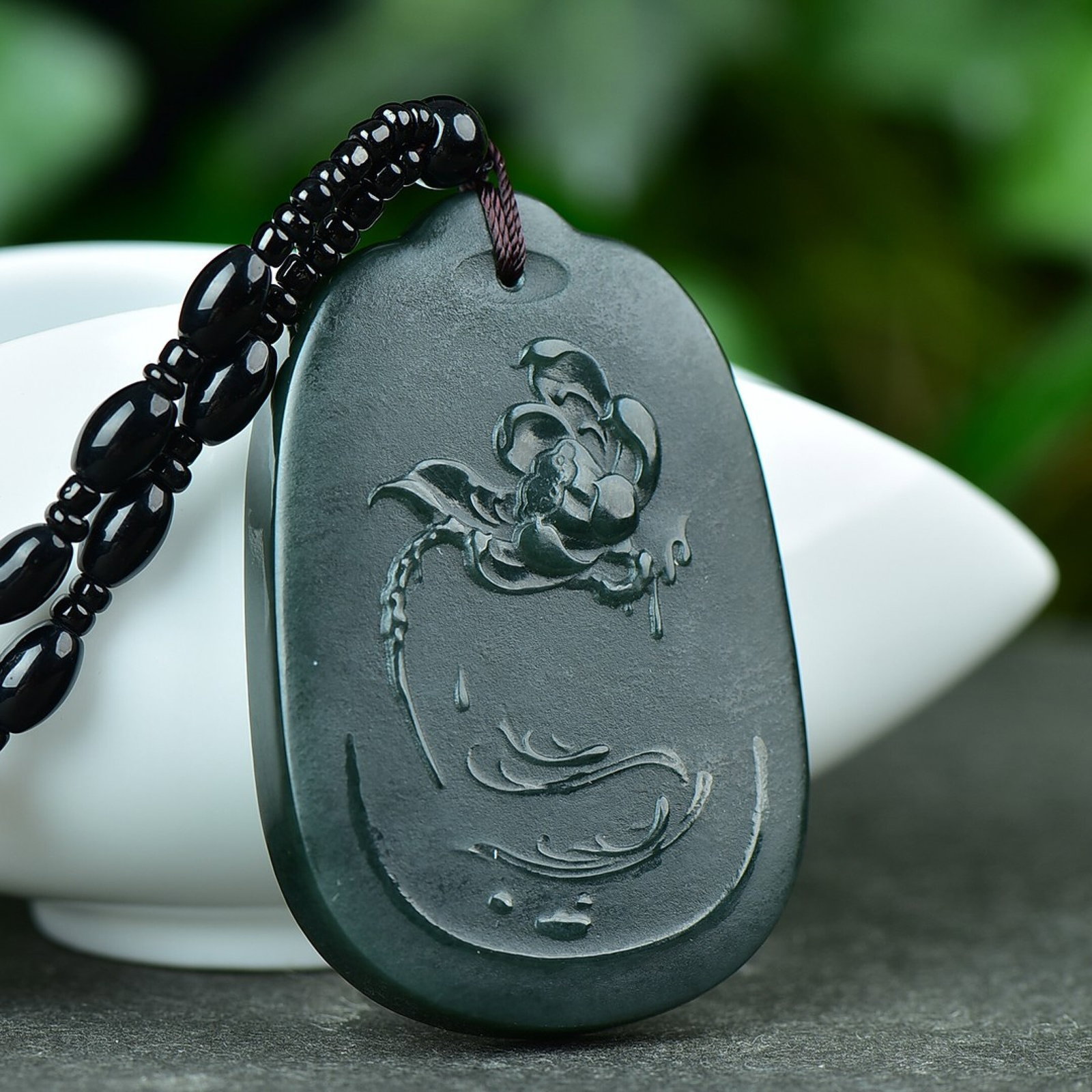 An Exquisite Sapphire Lotus Pattern Pendant: An Exquisite Sapphire Lotus Pattern Pendant,Size:40mmx60mm (寓意)吉祥 喜事连连 青玉莲花纹吊坠