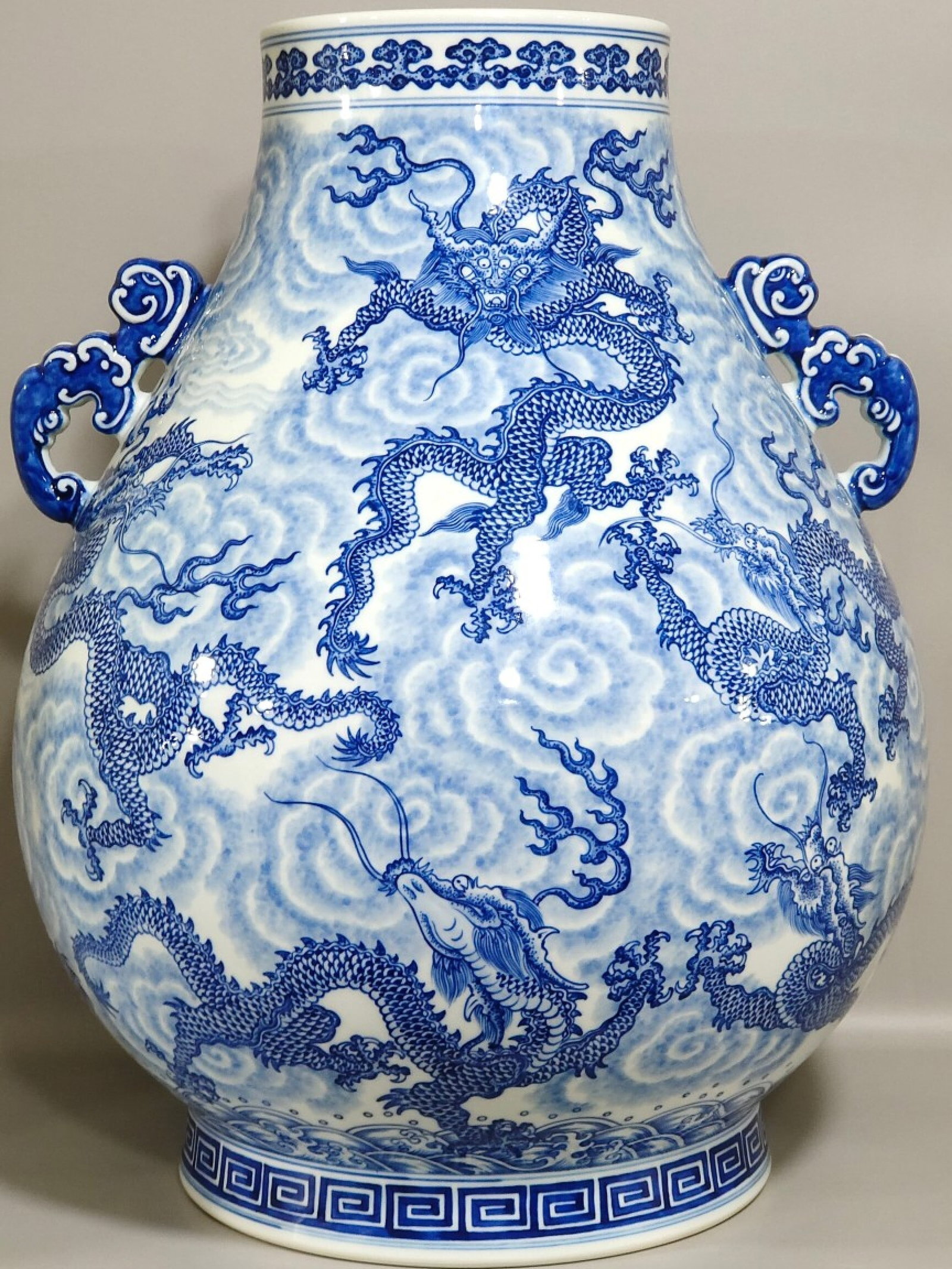 A Huge Blue and White Auspicious Cloud and Dragon Pattern Double-Ears Vase: A Huge Blue and White Auspicious Cloud and Dragon Pattern Double-Ears Vase,Qing Dynasty,China,Qianlong Six-character Mark,Size:19.3inx14.6in 青花祥云龙纹双