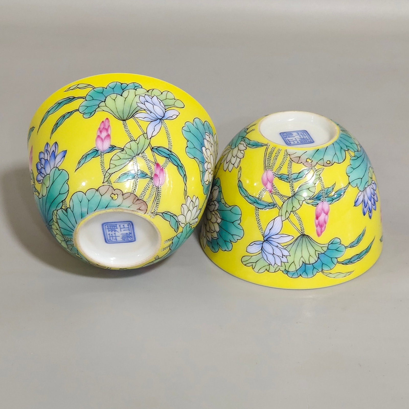 A Pair of Exquisite Enamel Yellow Glazed Lotus Pattern Cups: A Pair of Exquisite Enamel Yellow Glazed Lotus Pattern Cups,Qing Dynasty,China,Yongzheng Four-character Mark,Size:1.8inx2.8in 一对珐琅彩黄釉荷花&#