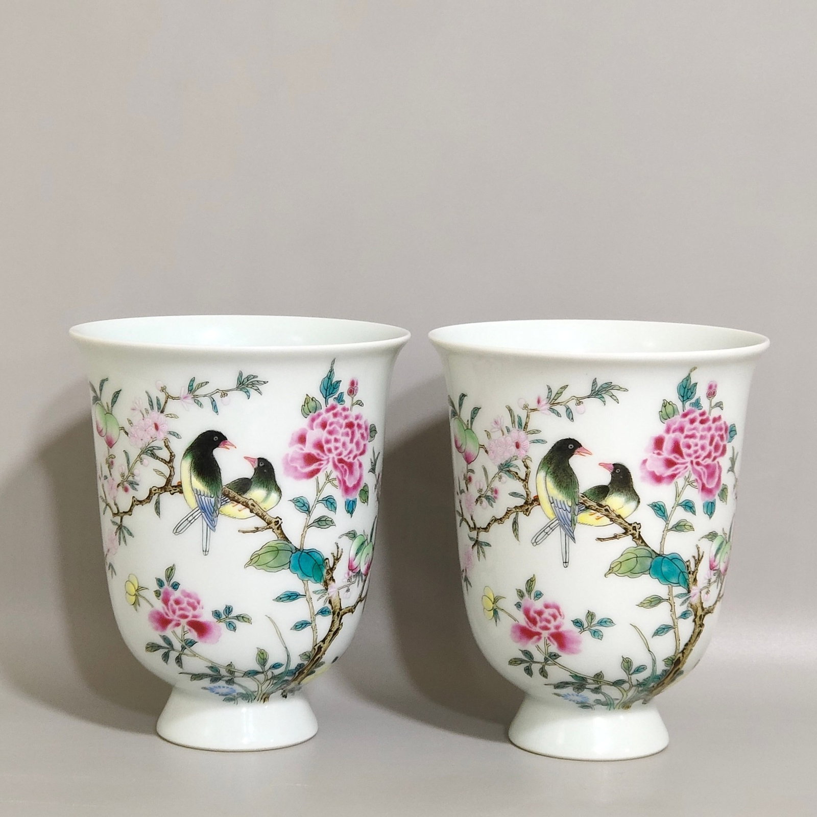 A Pair of Exquisite Famille-Rose Flower and Bird Pattern Stem Cups: A Pair of Exquisite Famille-Rose Flower and Bird Pattern Stem Cups,Qing Dynasty,China,Yongzheng Six-character Mark,Size:4.1inx3.3in 一对粉彩花鸟纹高$