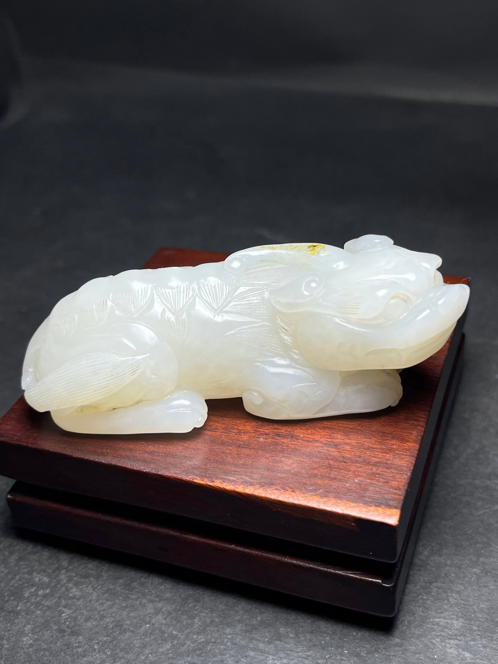 An Exquisite White Jade Auspicious Beast Hand Piece: An Exquisite White Jade Auspicious Beast Hand Piece,Qing Dynasty,China,Size:77mmx22mmx24mm,Weight:121g 白玉瑞兽手把件,中国清代