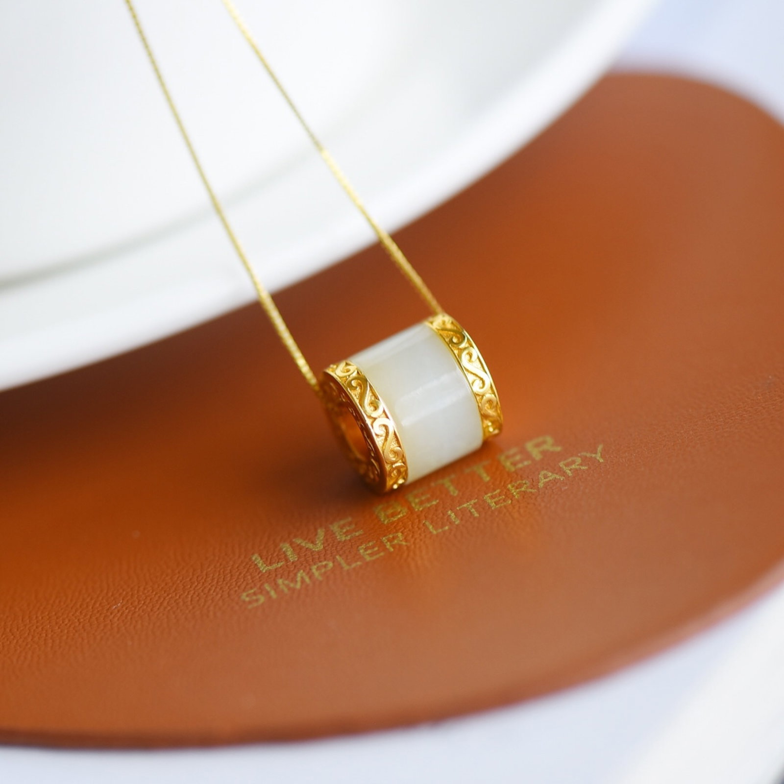 An Exquisite Sterling Silver-Gold Plated Inlaid White Jade Pendant: An Exquisite Sterling Silver-Gold Plated Inlaid White Jade Pendant,Size:7mmx12mm 纯银镀金镶白玉吊坠