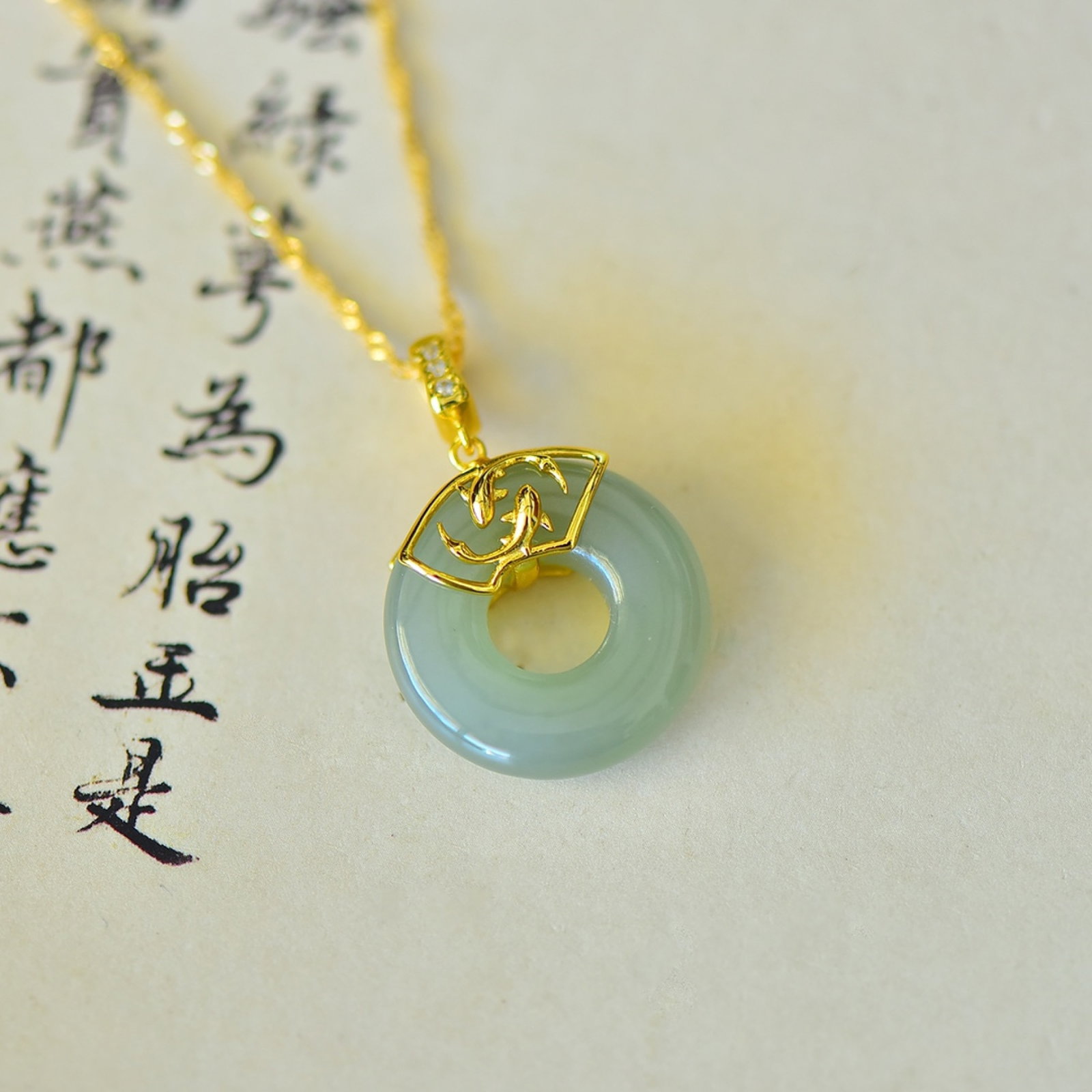 An Exquisite Sterling Silver-Gold Plated Inlaid Greenish Jade Pendant: An Exquisite Sterling Silver-Gold Plated Inlaid Greenish Jade Pendant,Size:20mmx20mm 纯银镀金镶青白玉吊坠