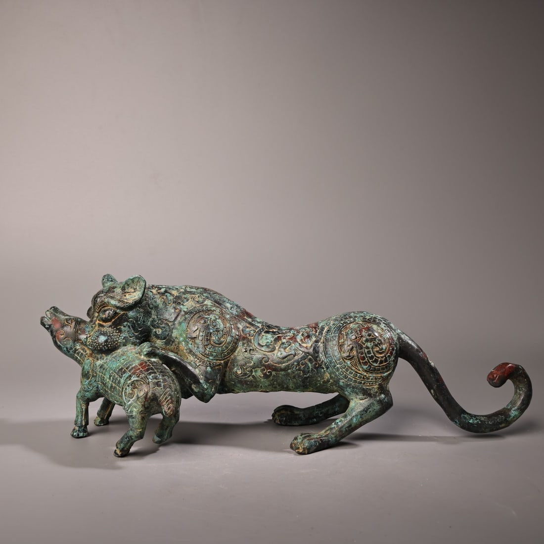 A Exquisite Bronze Tiger Ornament: A Exquisite Bronze Tiger Ornament,Ancient Time, China,Size:4.1inx13in ,Weight:1600g 青铜虎摆件,远古时期