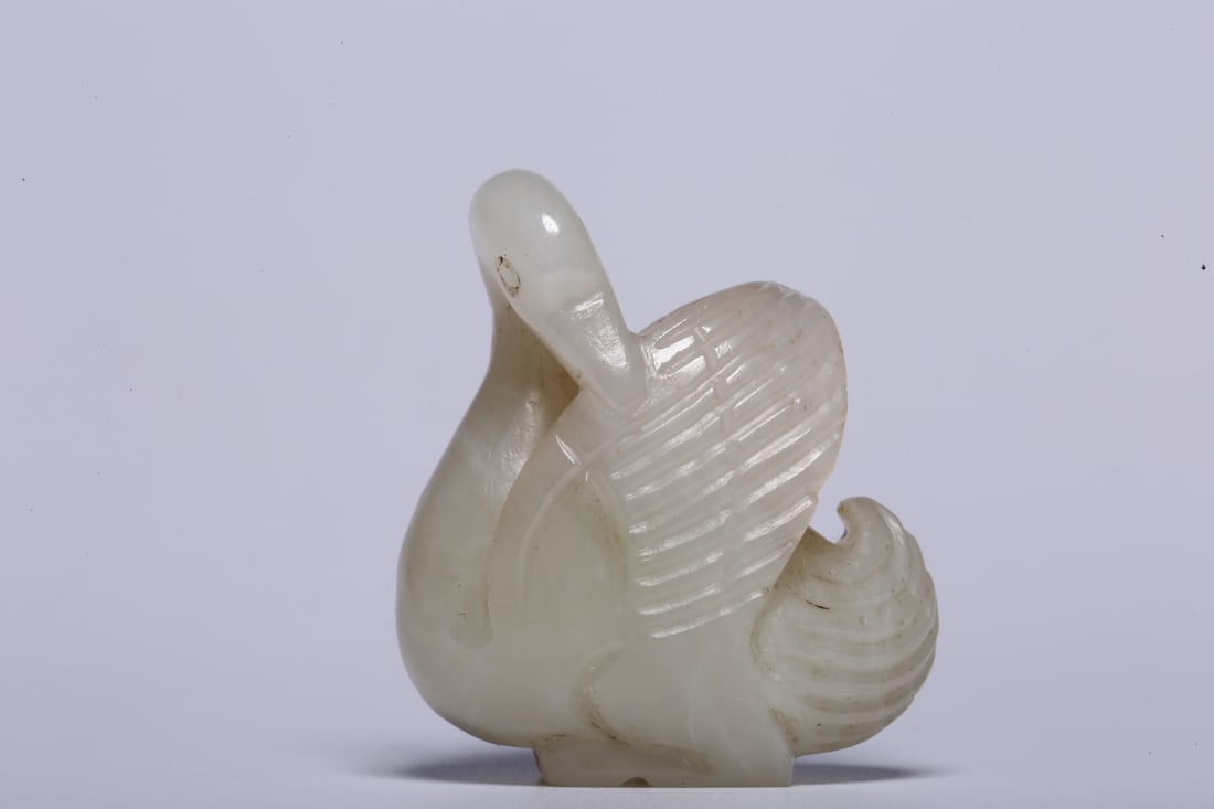 A Exquisite Hotan Phoenix Bird Ornament: A Exquisite Hotan Phoenix Bird Ornament,Song Dynasty, China,Size:1.3inx0.8inx1.5in,Weight:26.8g 和田凤鸟摆件,中国宋代