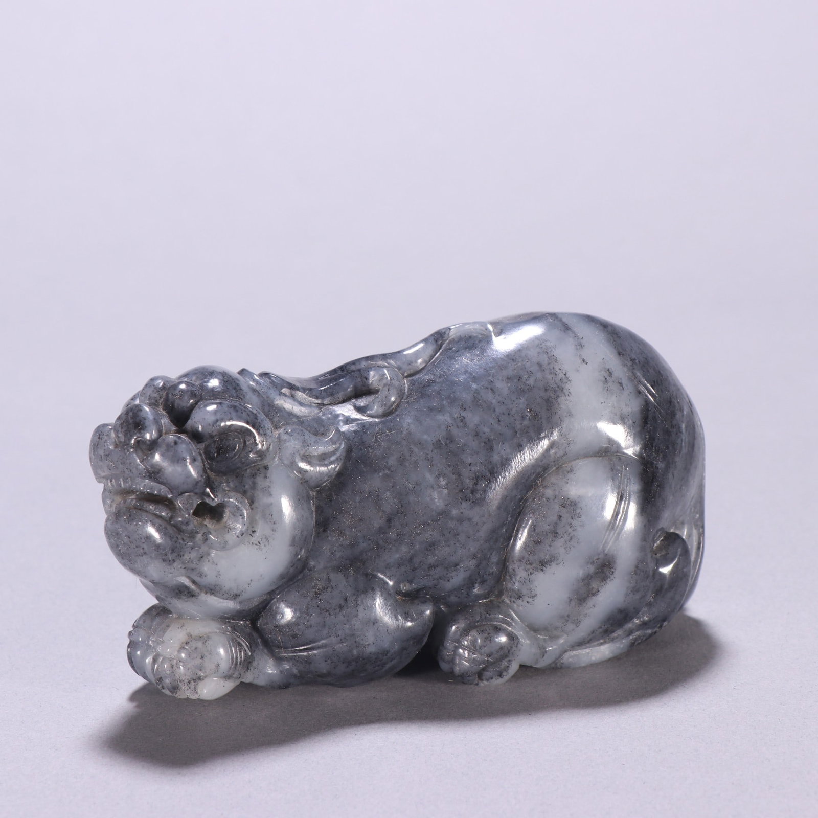 A Exquisite Hotan Jade Auspicious Beast Ornament: A Exquisite Hotan Jade Auspicious Beast Ornament,Qing Dynasty, China,Size:4.1inx2.2in,Weight:472g 和田玉瑞兽摆件,中国清代