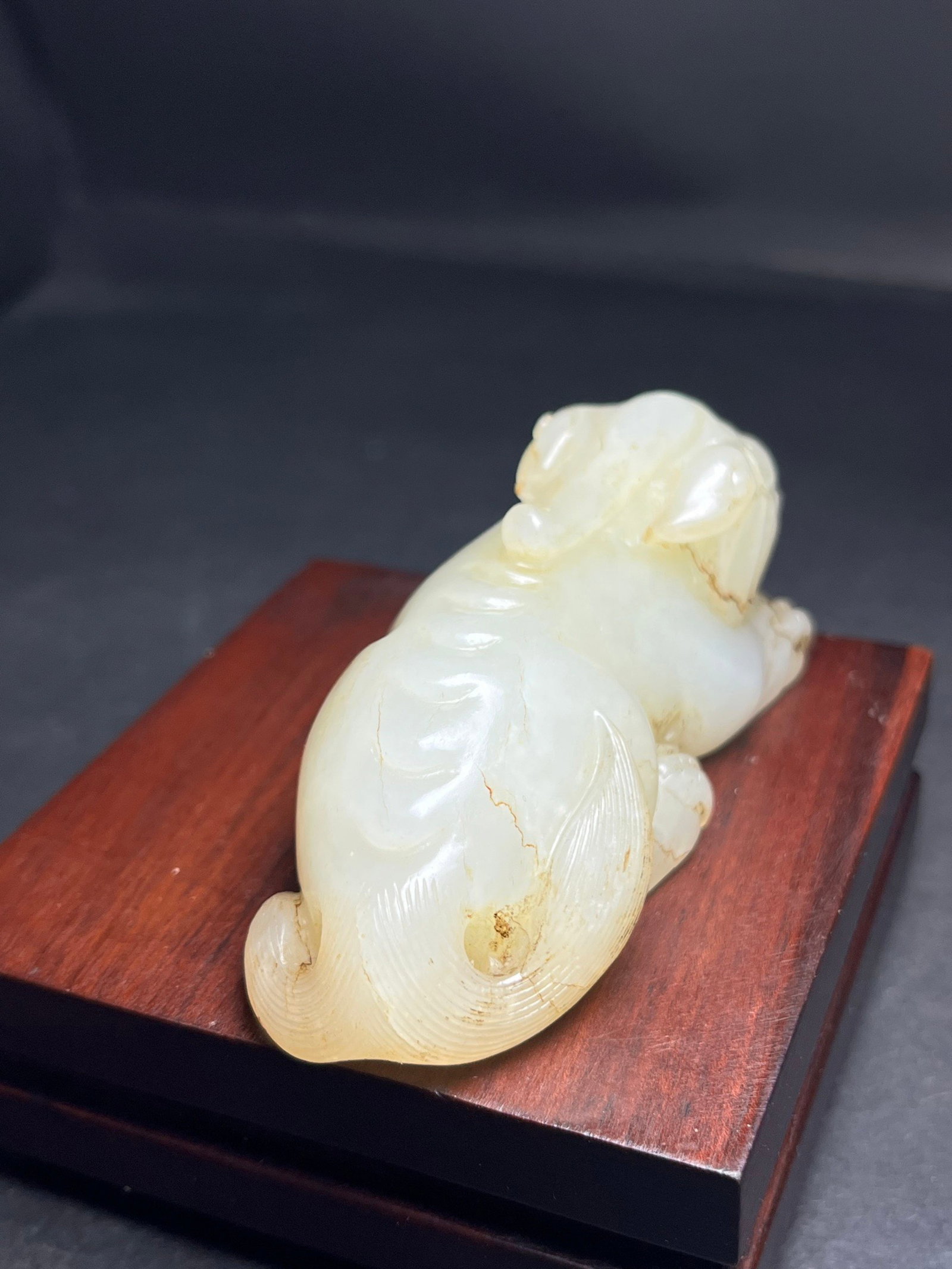 An Exquisite White Jade Auspicious Beast Hand Piece: An Exquisite White Jade Auspicious Beast Hand Piece,Qing Dynasty,China,Size:81mmx33mmx35mm,Weight:130g 白玉瑞兽手把件,中国清代