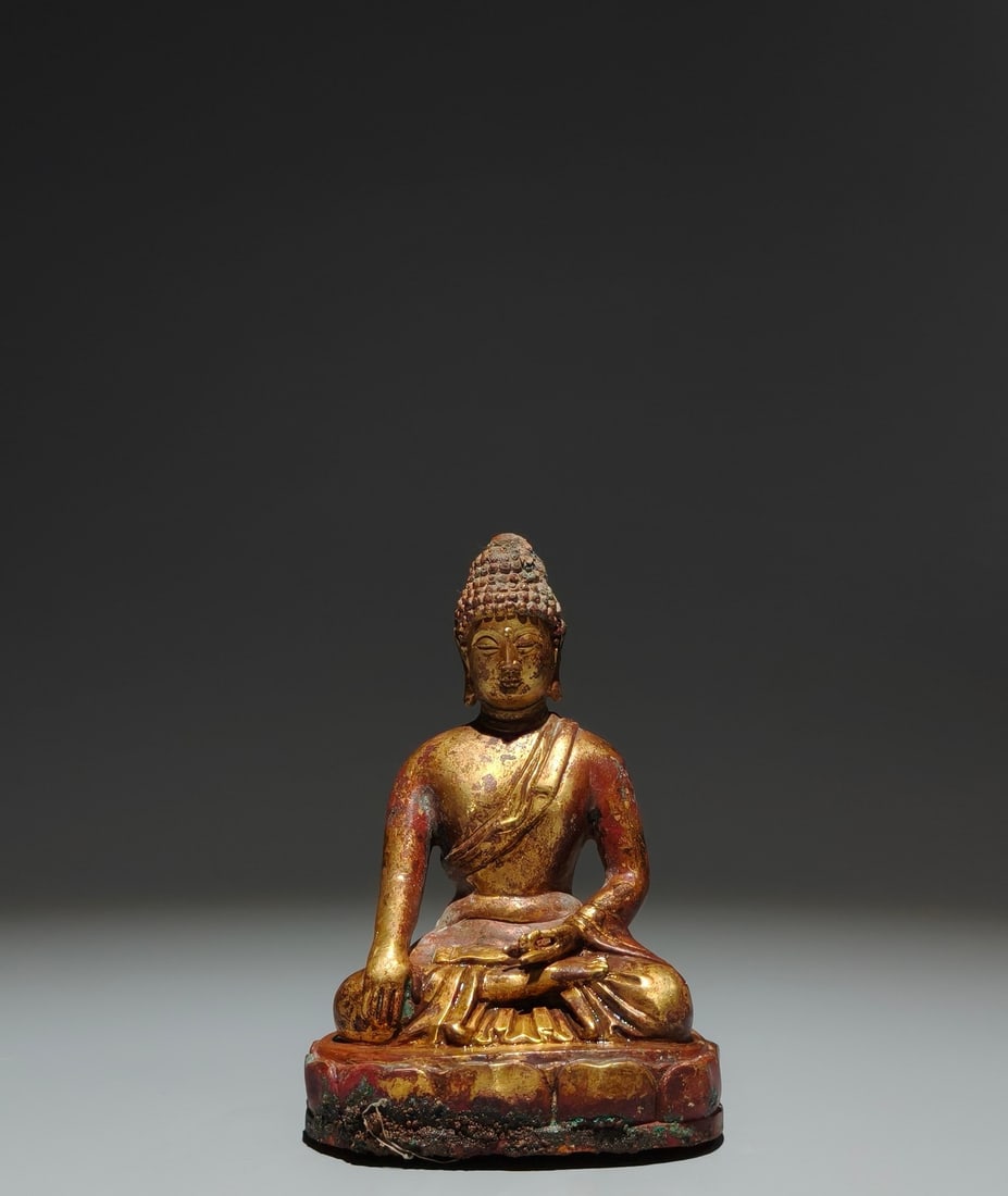 A Solemn Gilt Bronze Statue of Sakyamuni: A Solemn Gilt Bronze Statue of Sakyamuni,Tang Dynasty,China,Size:5.1inx3.5inx2.8in 铜鎏金释迦摩尼像,中国唐代