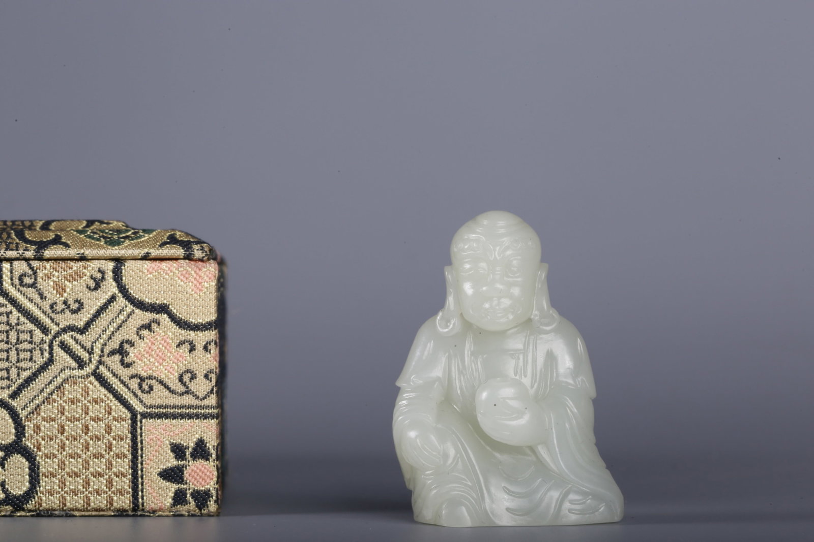 An Exquisite White Jade Statue of Arhat Ornament: An Exquisite White Jade Statue of Arhat Ornament,Qing Dynasty,China,Size:1.4inx0.7inx2in,Weight:41.1g 白玉罗汉像摆件，中国清代