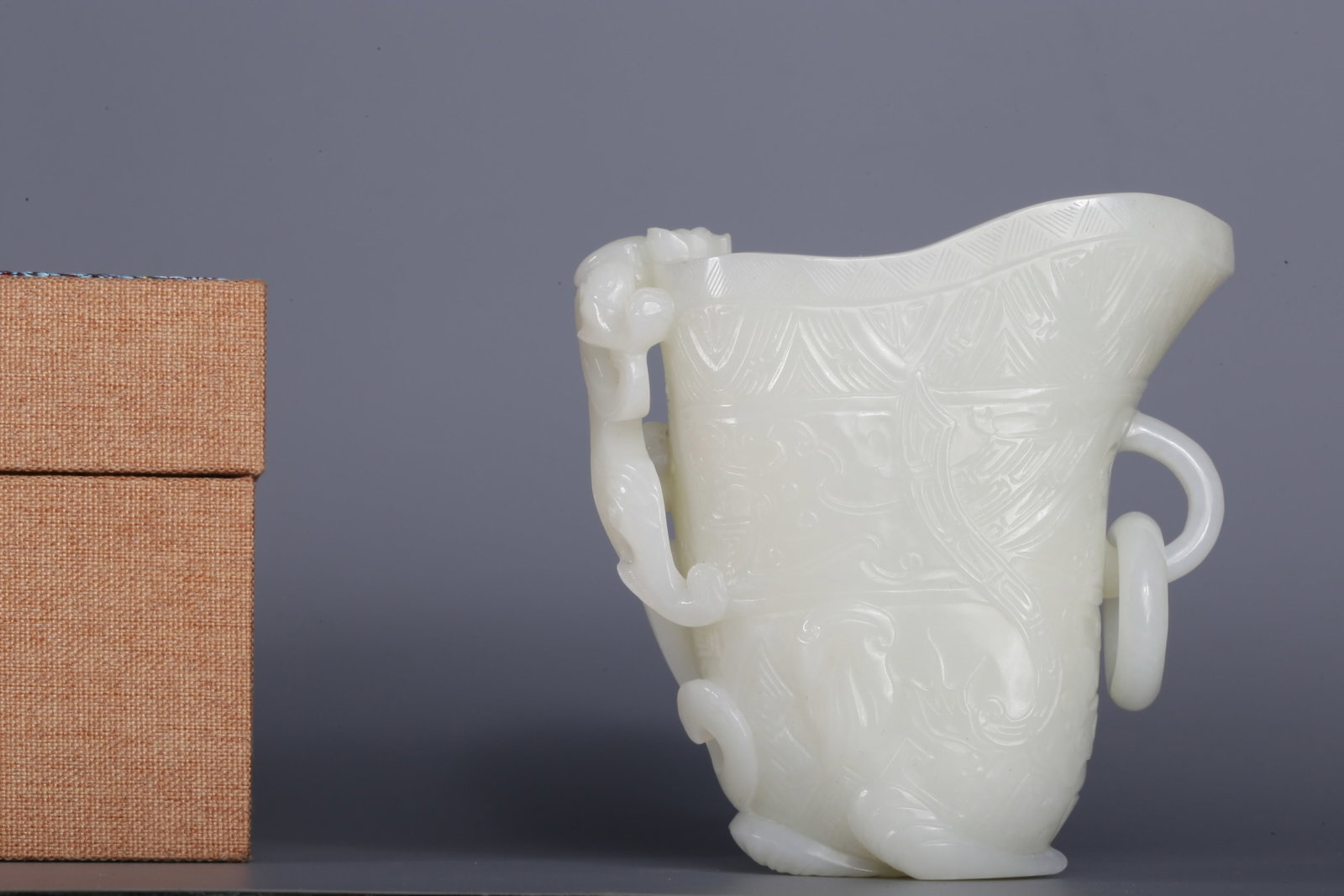 An Exquisite White Jade Chi-Dragon Pattern Goblet: An Exquisite White Jade Chi-Dragon Pattern Goblet,Qing Dynasty,China,Size:4.1inx2.2inx4.2in,Weight:412g 白玉螭龙纹爵杯，中国清代