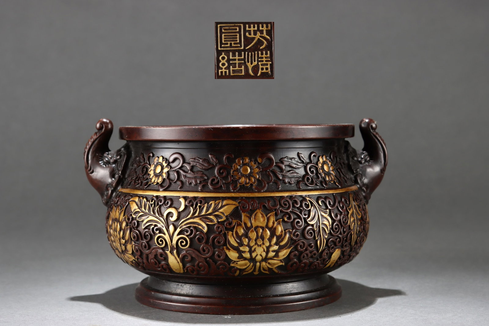 An Exquisite Gilt Bronze Lotus Pattern Elephant-Ears Censer: An Exquisite Gilt Bronze Lotus Pattern Elephant-Ears Censer,Ming Dynasty,China,With Mark,Size:4inx5.5inx6.3inx7.1in,Weight:3000g 铜鎏金缠枝莲纹象耳