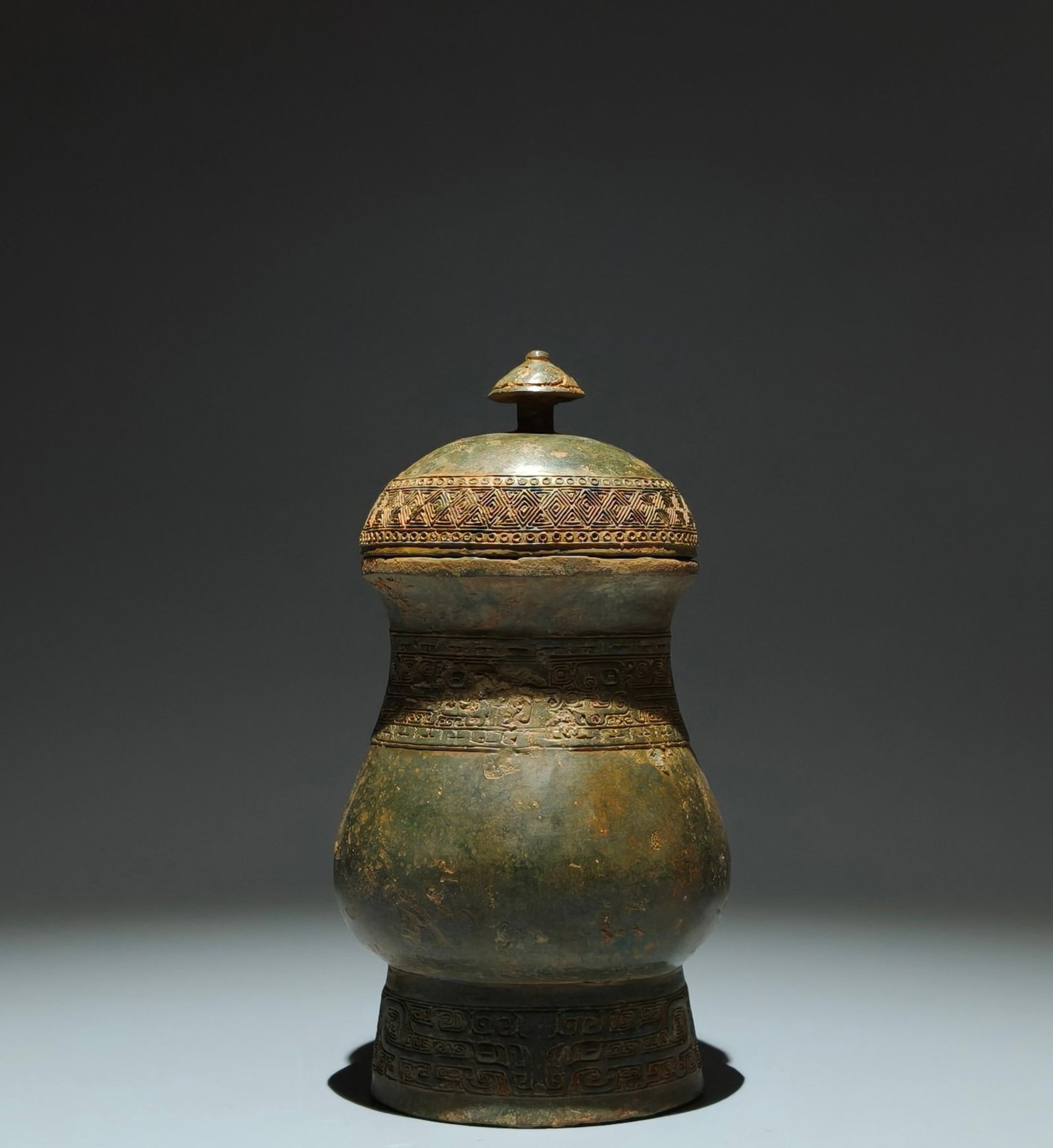 An Archaic Bronze Beast-Face Pattern Cover Jar: An Archaic Bronze Beast-Face Pattern Cover Jar,Shang Dynasty,China,Size:8.1inx4.1inx3.5in 青铜兽面纹盖罐,中国商代
