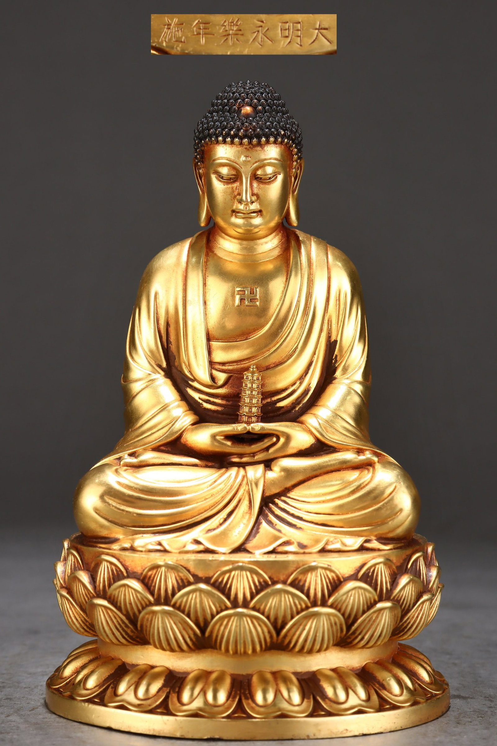 A Solemn Gilt Bronze Statue of Sakyamuni: A Solemn Gilt Bronze Statue of Sakyamuni,Ming Dynasty,China,Yongle Six-character Mark,Size:6.5inx4.1in,Weight:1800g