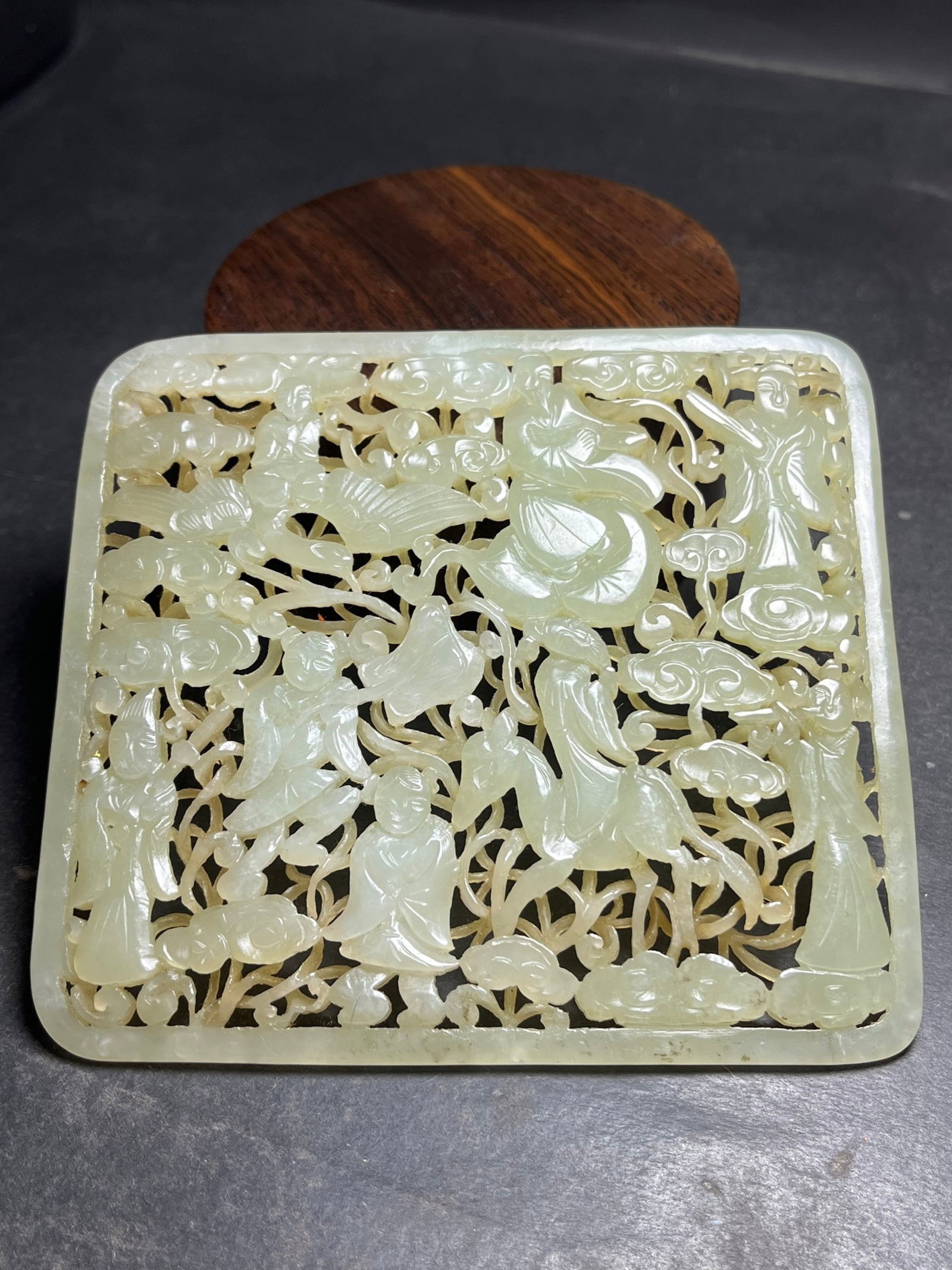 An Exquisite White Jade Auspicious Cloud and Figure Pattern Pendant: An Exquisite White Jade Auspicious Cloud and Figure Pattern Pendant,Qing Dynasty,China,Size:116mmx7mmx106mm,Weight:145g 白玉祥云人物纹挂件,中