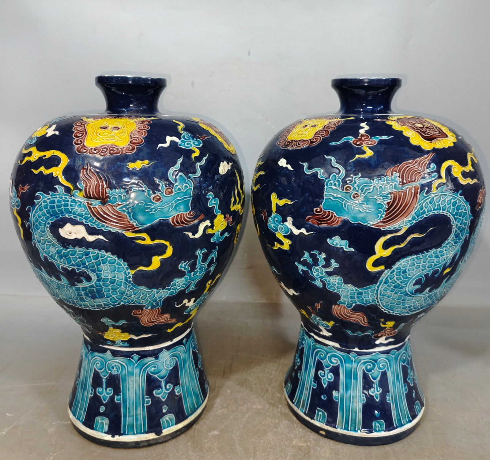 A Pair of Rare Fahua Glazed Auspicious Cloud and Dragon Pattern Vases: A Pair of Rare Fahua Glazed Auspicious Cloud and Dragon Pattern Vases,Qing Dynasty,China,Size:6.3inx13.4in 一对珐华彩祥云龙纹瓶,中