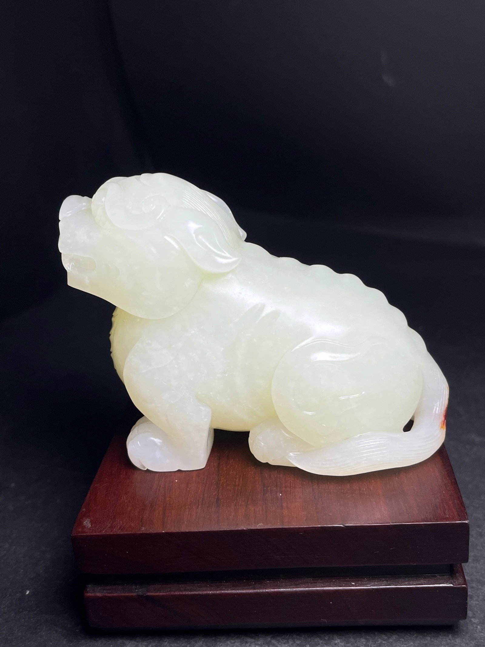 An Exquisite White Jade Auspicious Beast Hand Piece: An Exquisite White Jade Auspicious Beast Hand Piece,Qing Dynasty,China,Size:75mmx37mmx64mm,Weight:261g 白玉瑞兽手把件,中国清代